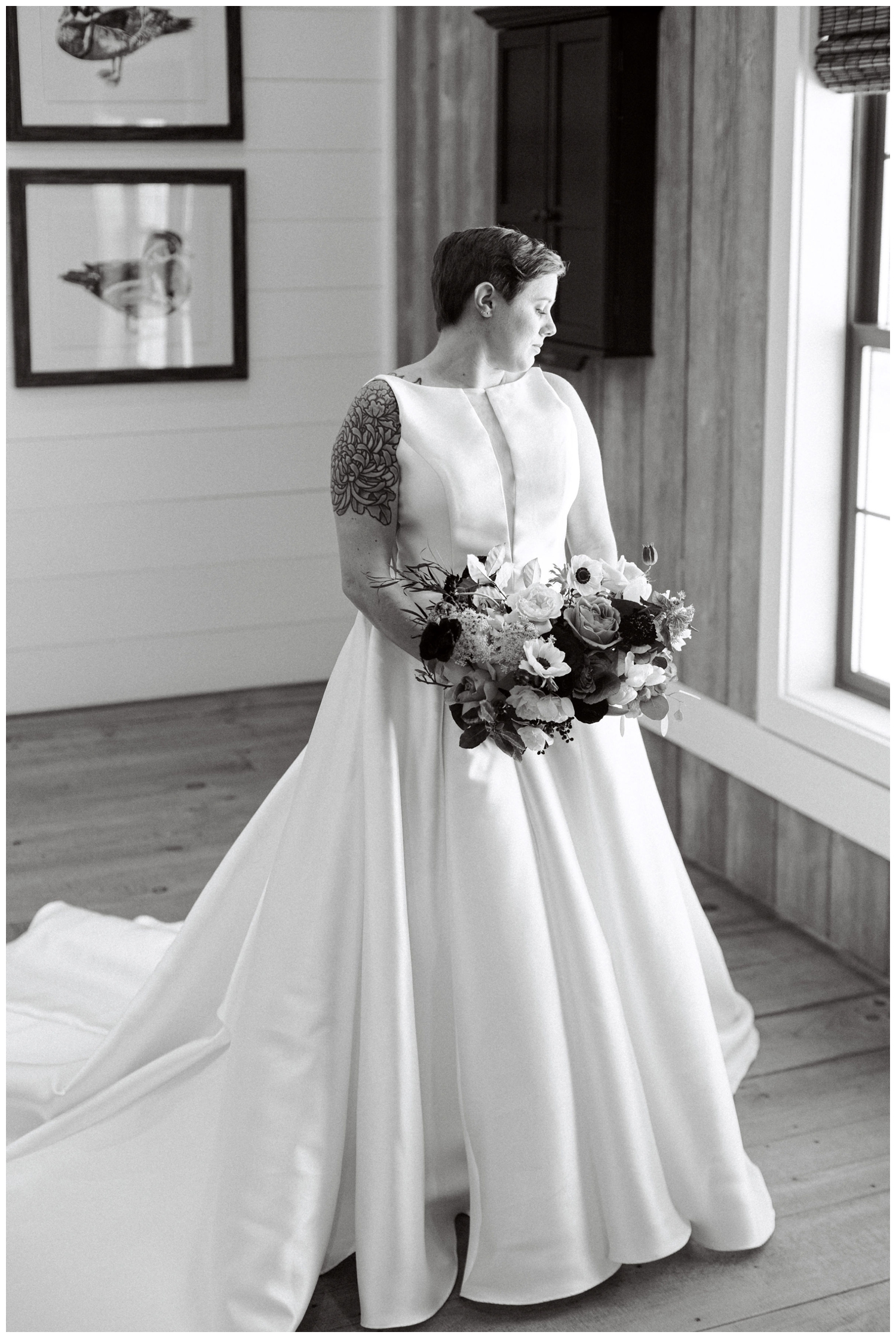 black and white photo of bride staring out window at Arrowhead Hill in Montgomery, Texas