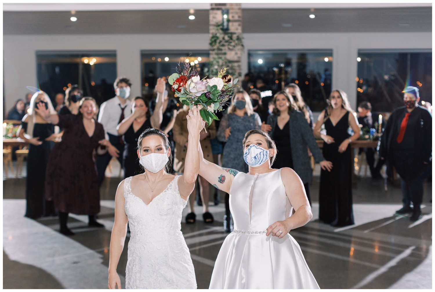 brides throwing bouquet at reception hall at Arrowhead HIll