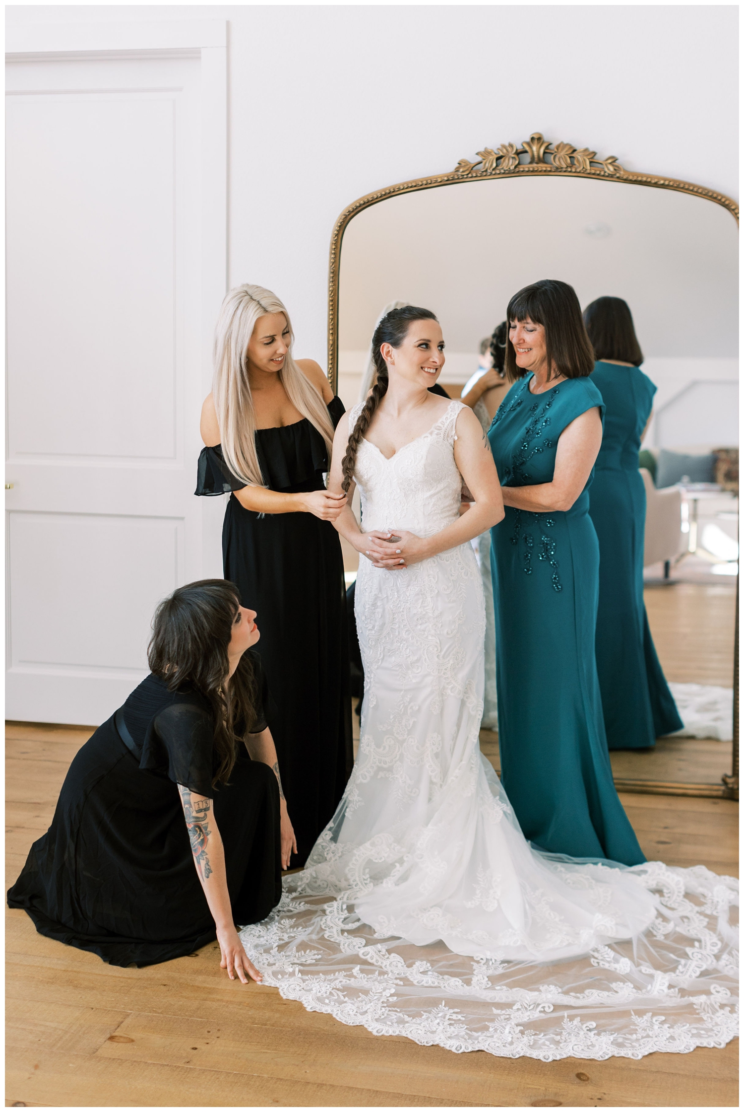 bride with bridal party getting ready