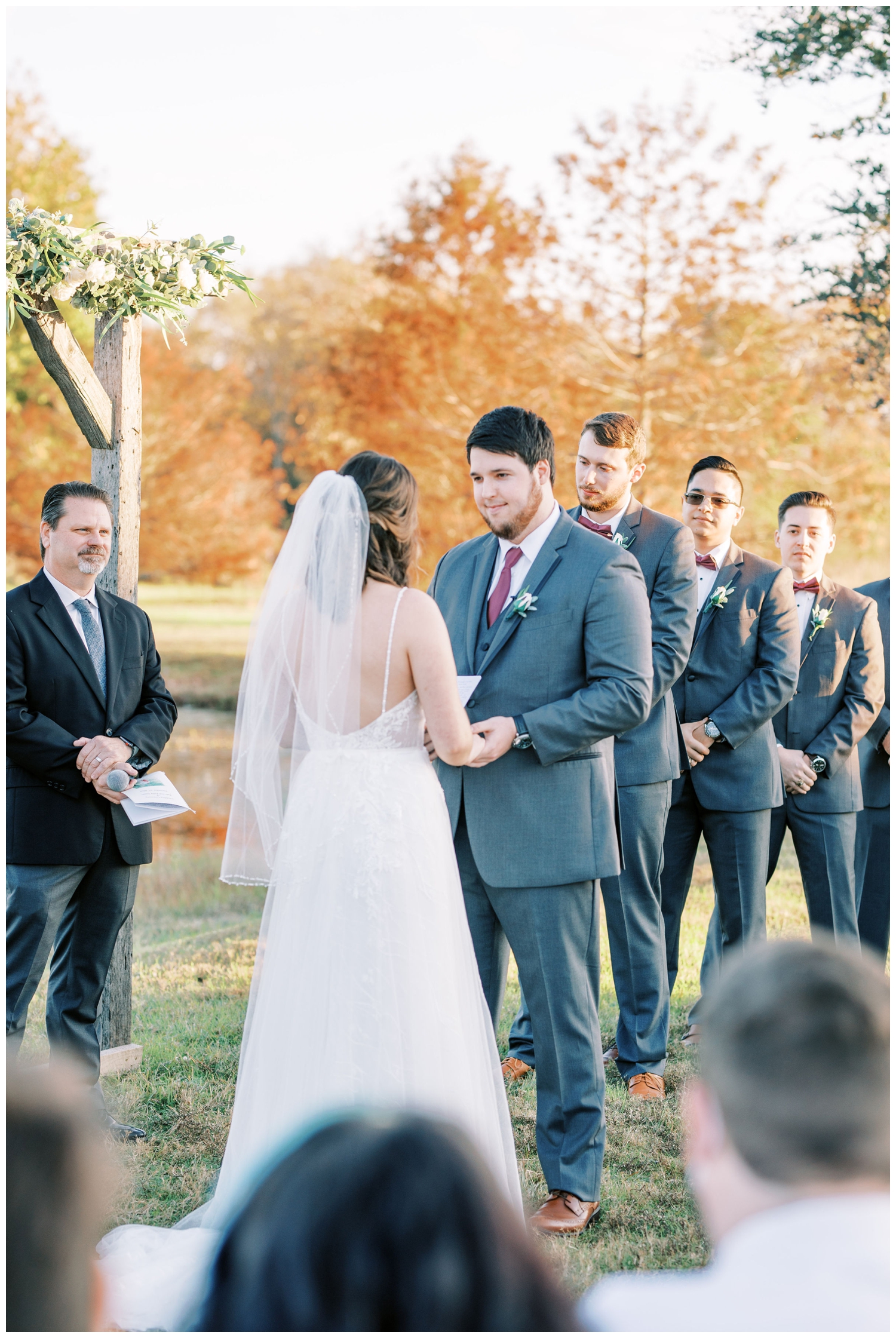 bride and groom exchanging vows at outdoor ceremony at Beckendorff Farms Wedding