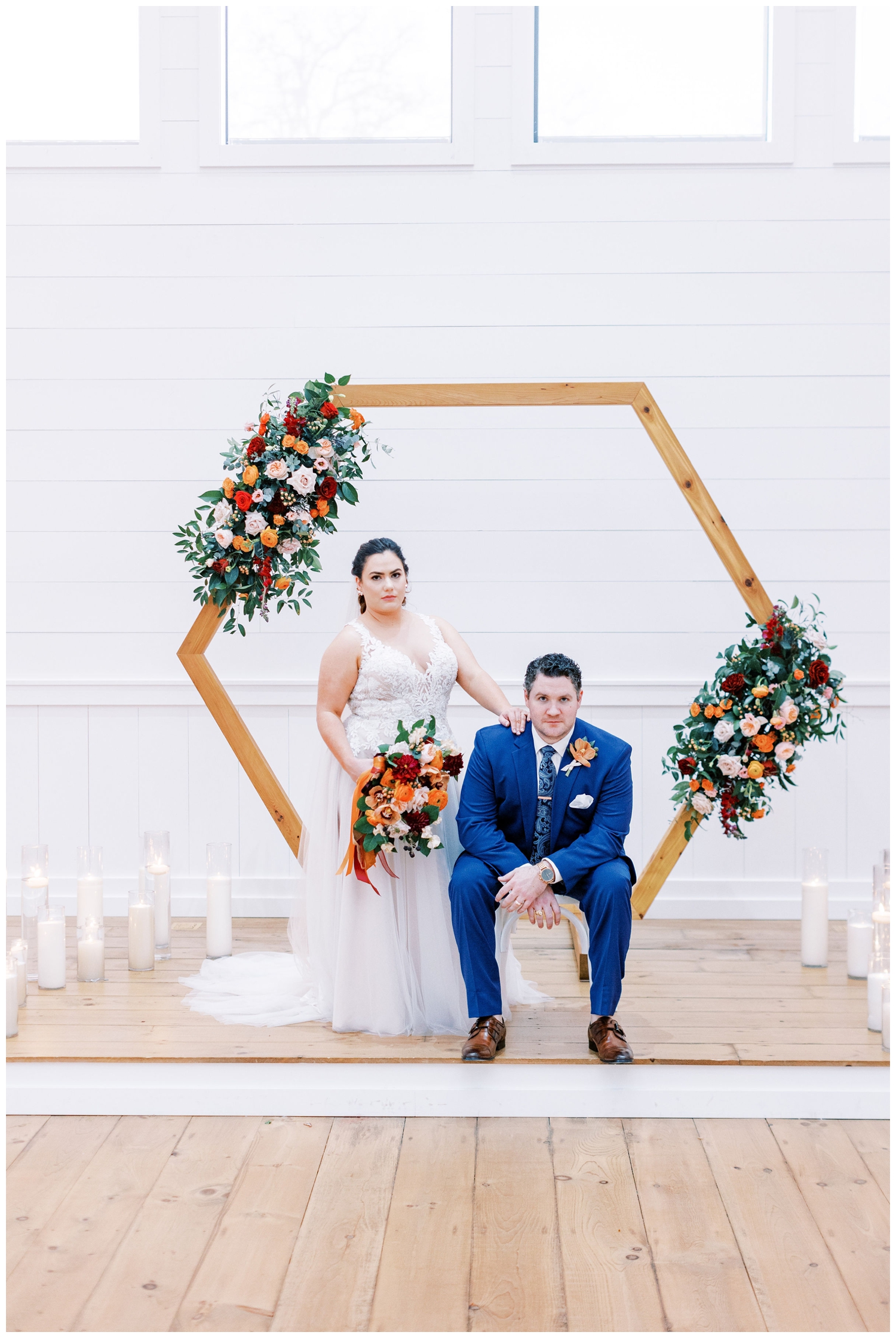 bride and groom portrait with ceremony arch inside Arrowhead Hill chapel