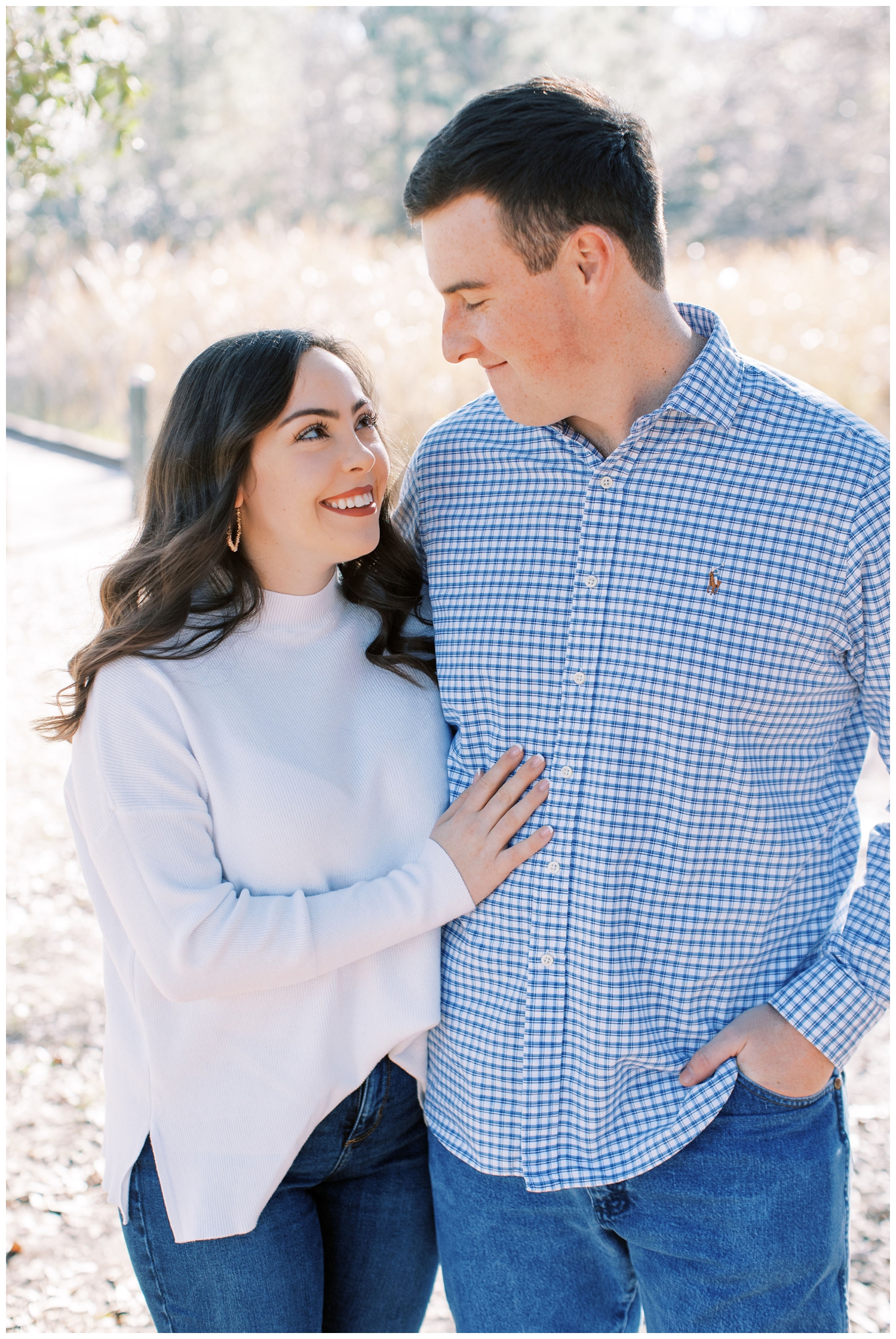 Houston engagement session with couple standing outside at Hermann Park