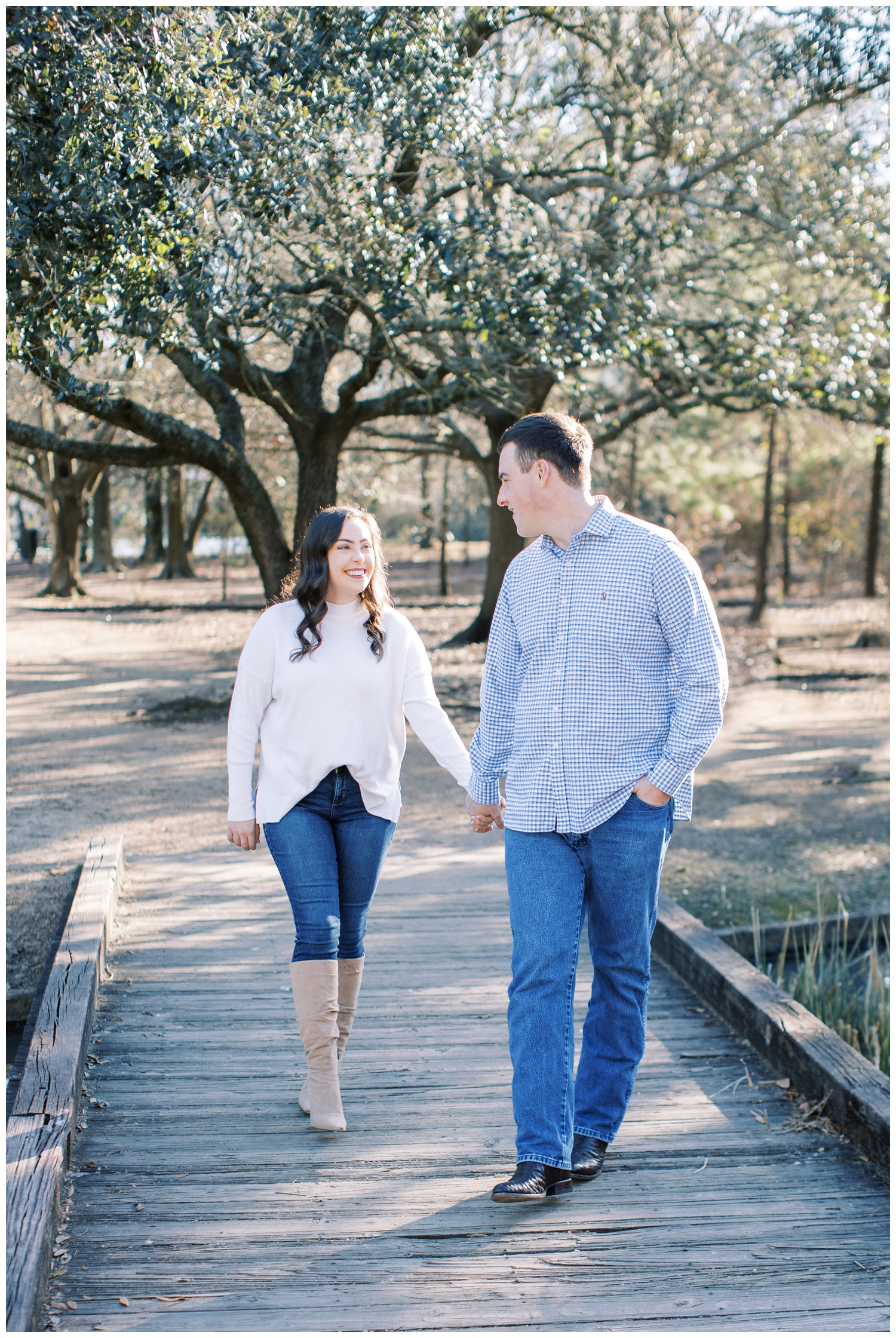 couple walking on a bridge at Houston Hermann Park