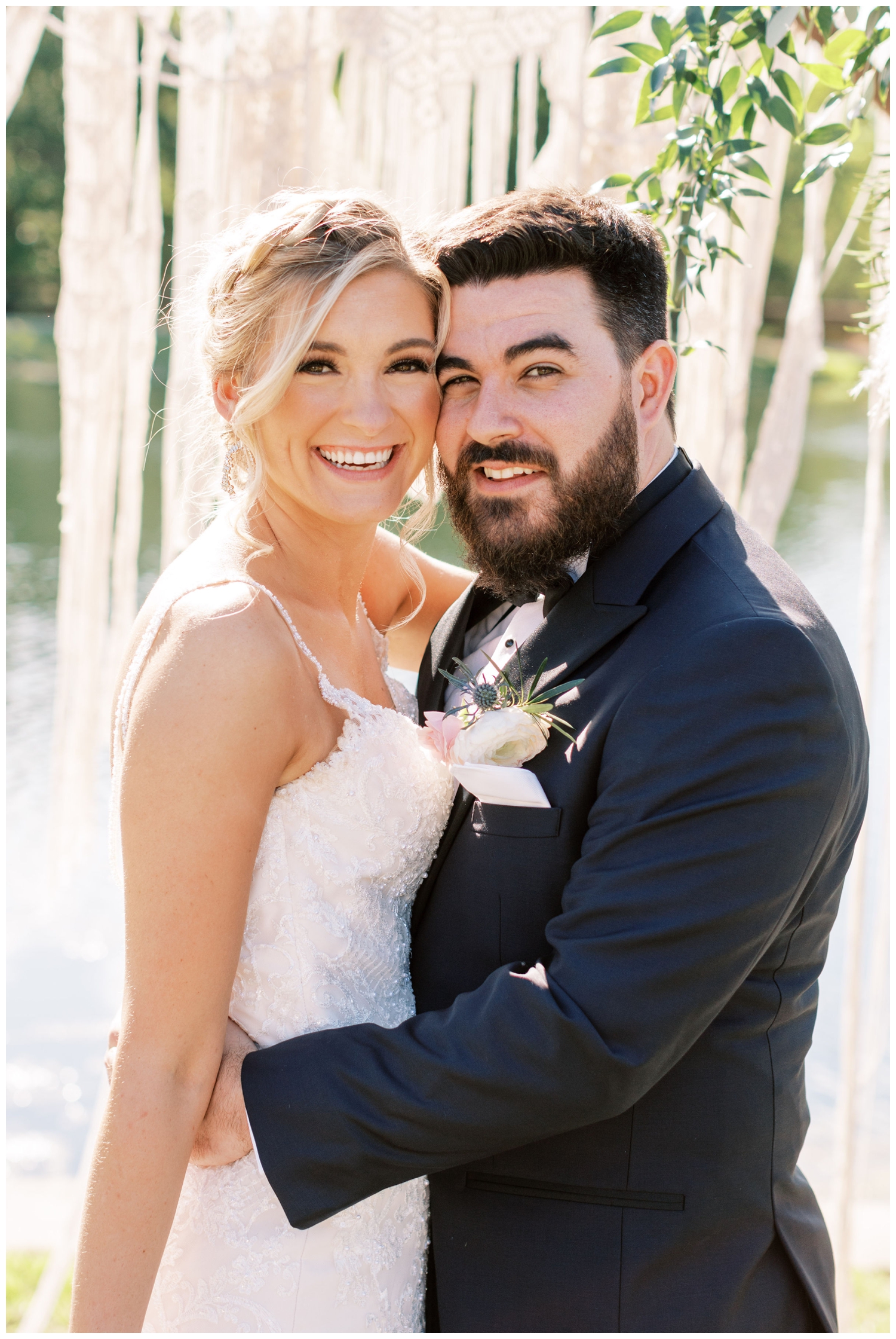 newlyweds smiling at camera closeup
