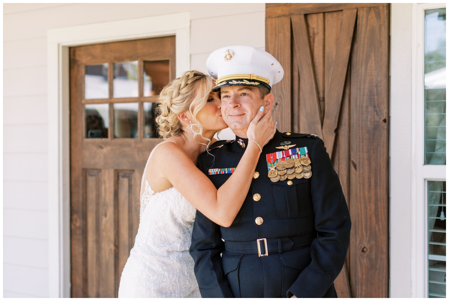 bride kissing father after first look at Peach Creek Ranch Wedding venue
