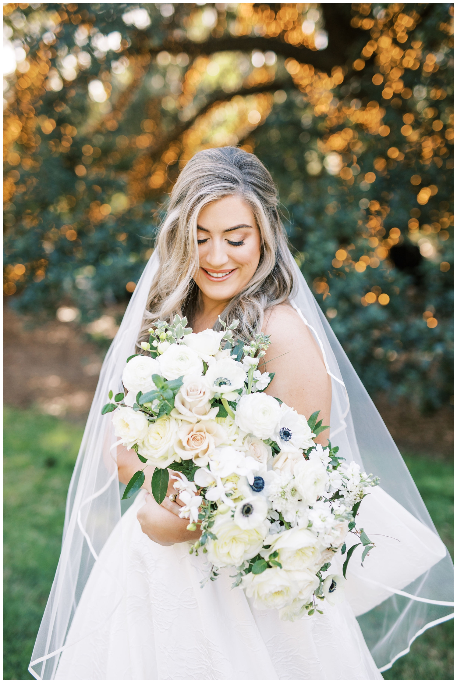 bridal portrait on the lawn the Houstonian Hotel wedding with white bouquet