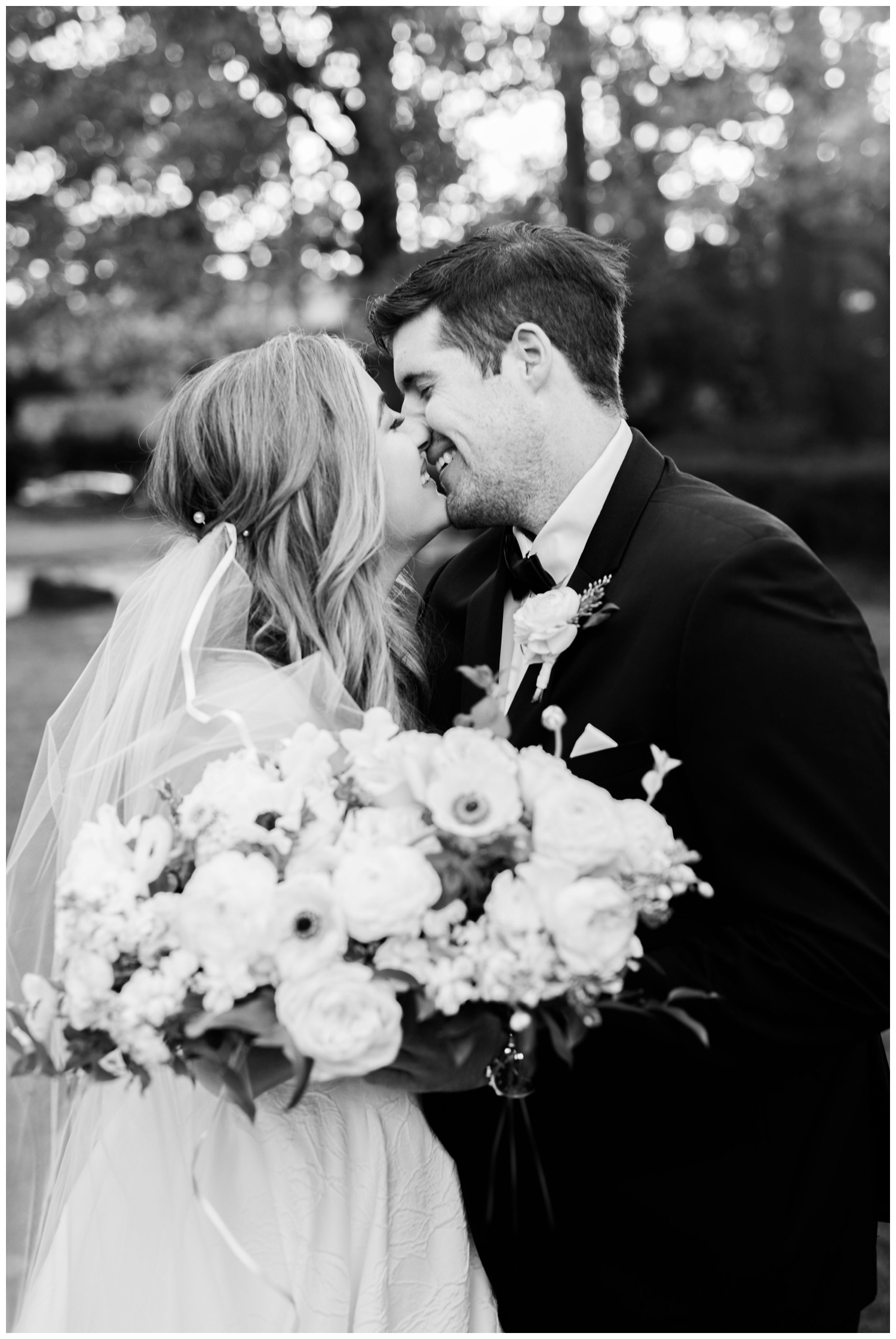 black and white bride and groom kissing portrait outside the Houstonian Hotel wedding