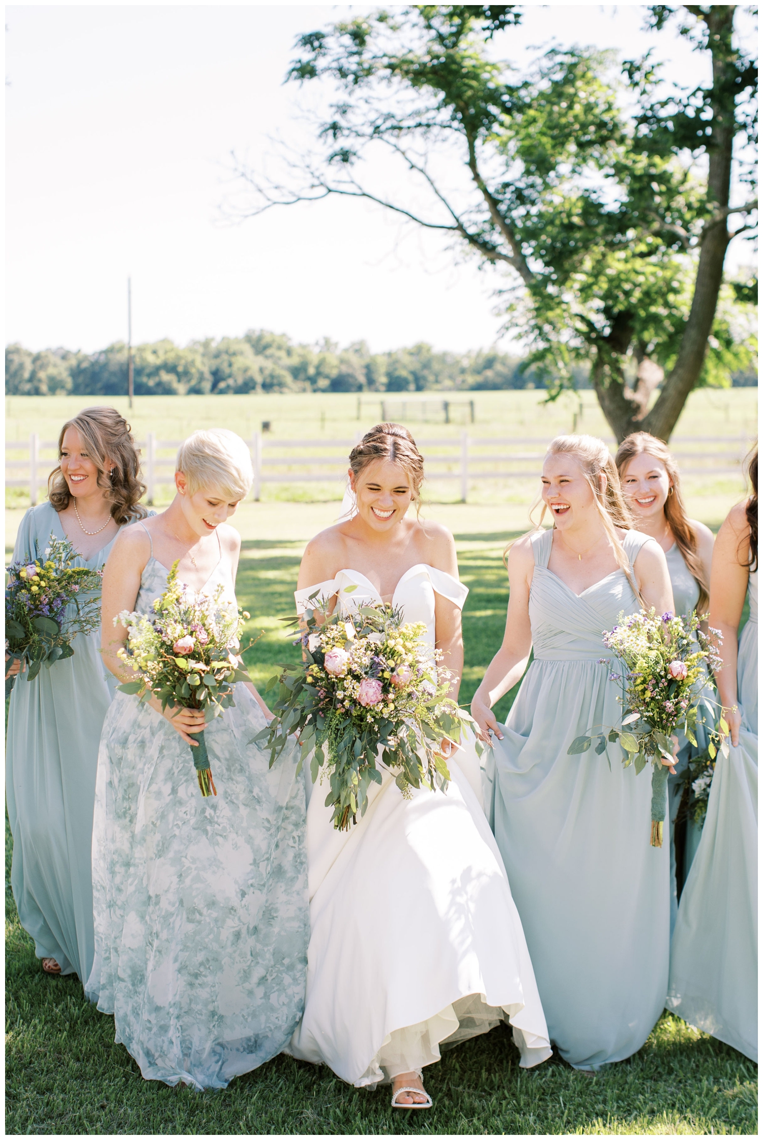 bride and bridesmaid with bouquets walking