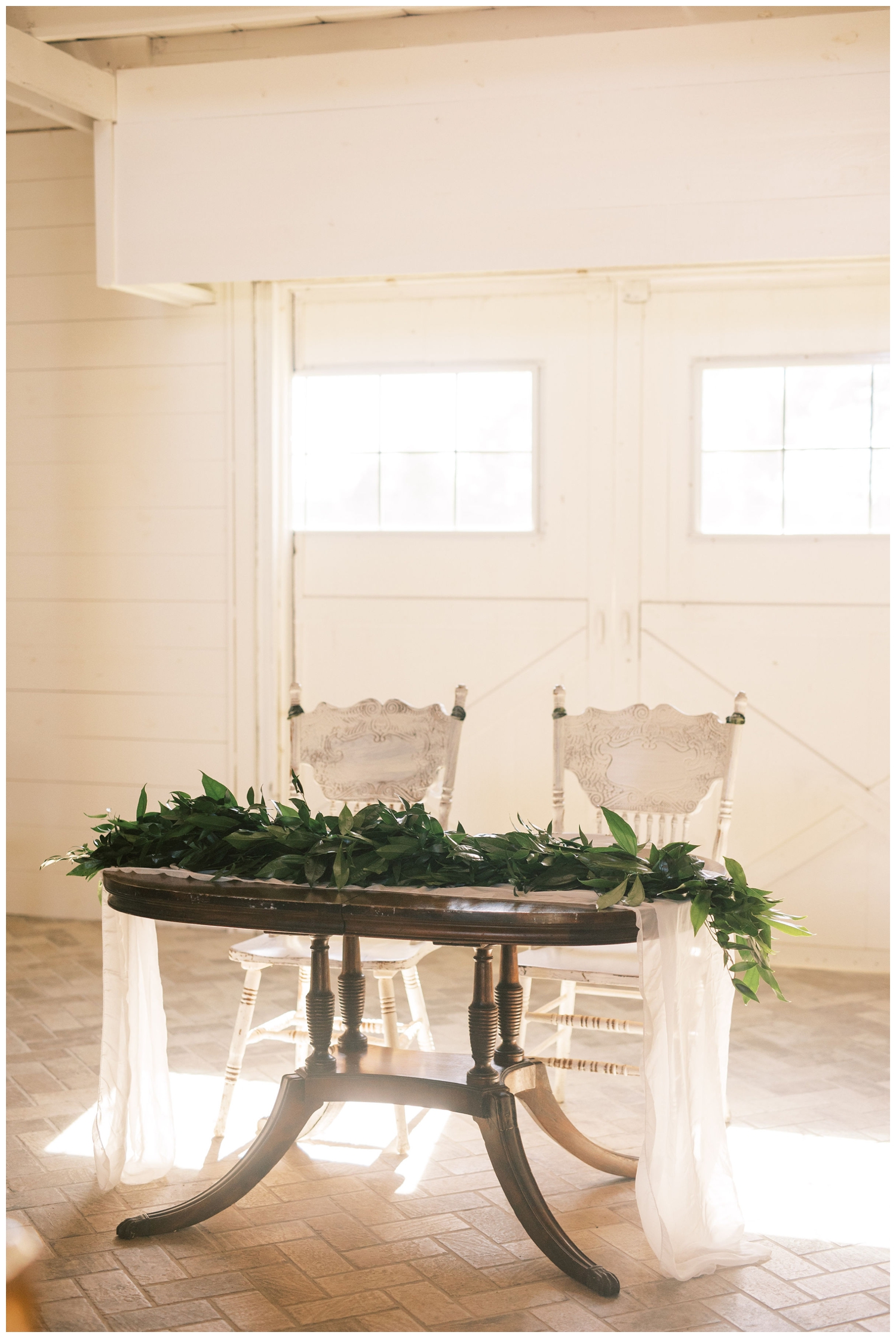 sweetheart table inside Houston white barn wedding reception