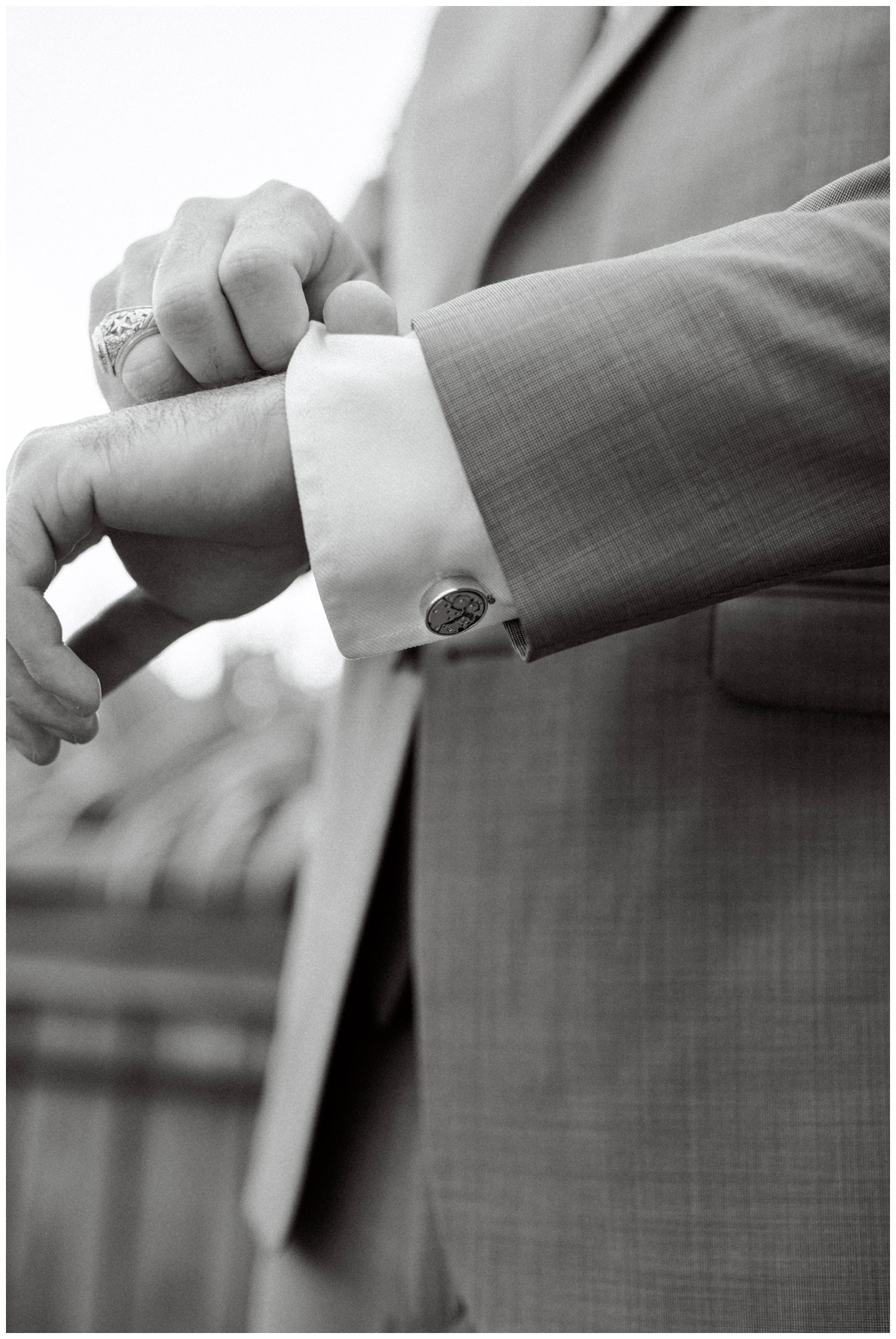 groom and cufflinks in black and white