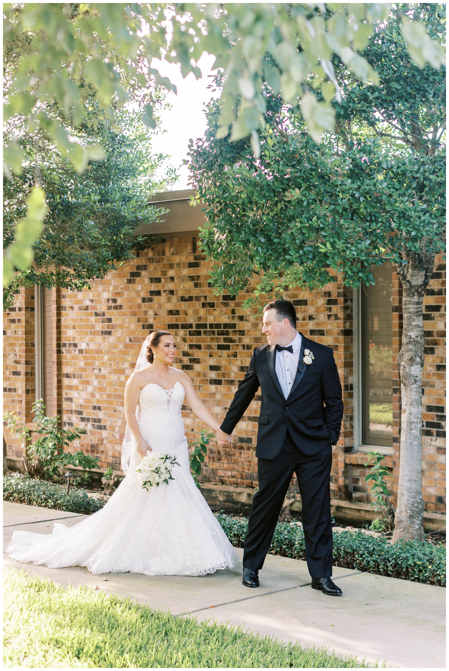 bride and groom holding hands and walking at Houston Junior League wedding