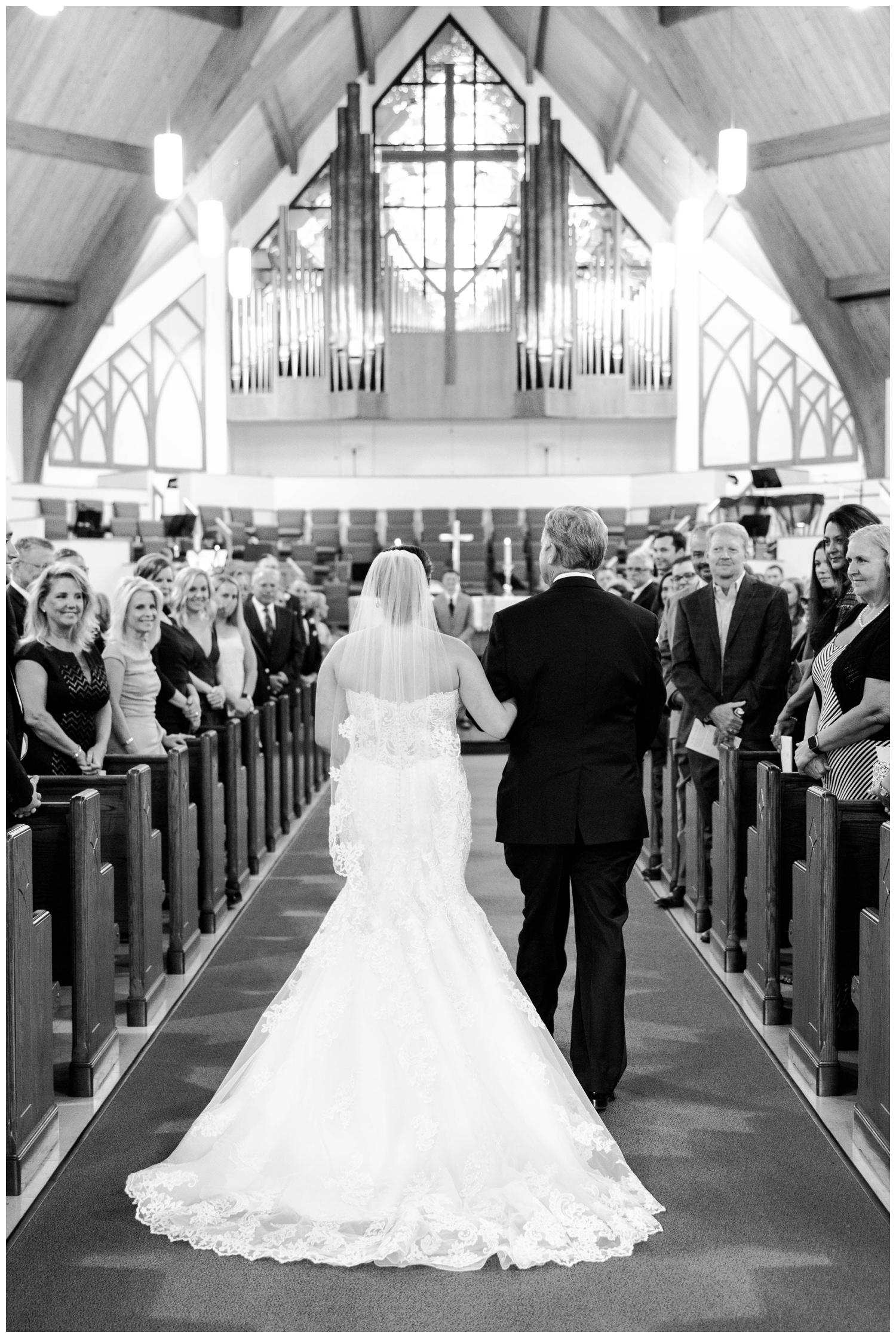 father and bride walking down aisle for ceremony at Sugarland Methodist Church