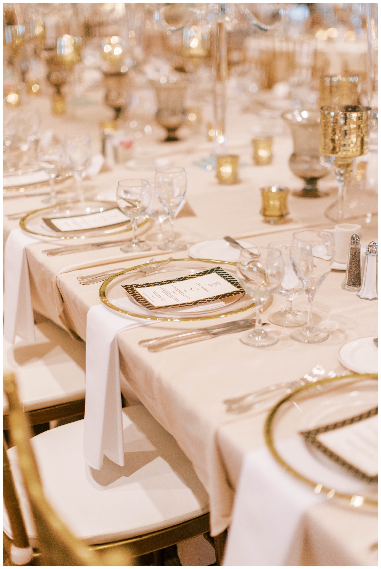 white and gold placesetting at Houston Junior League wedding reception
