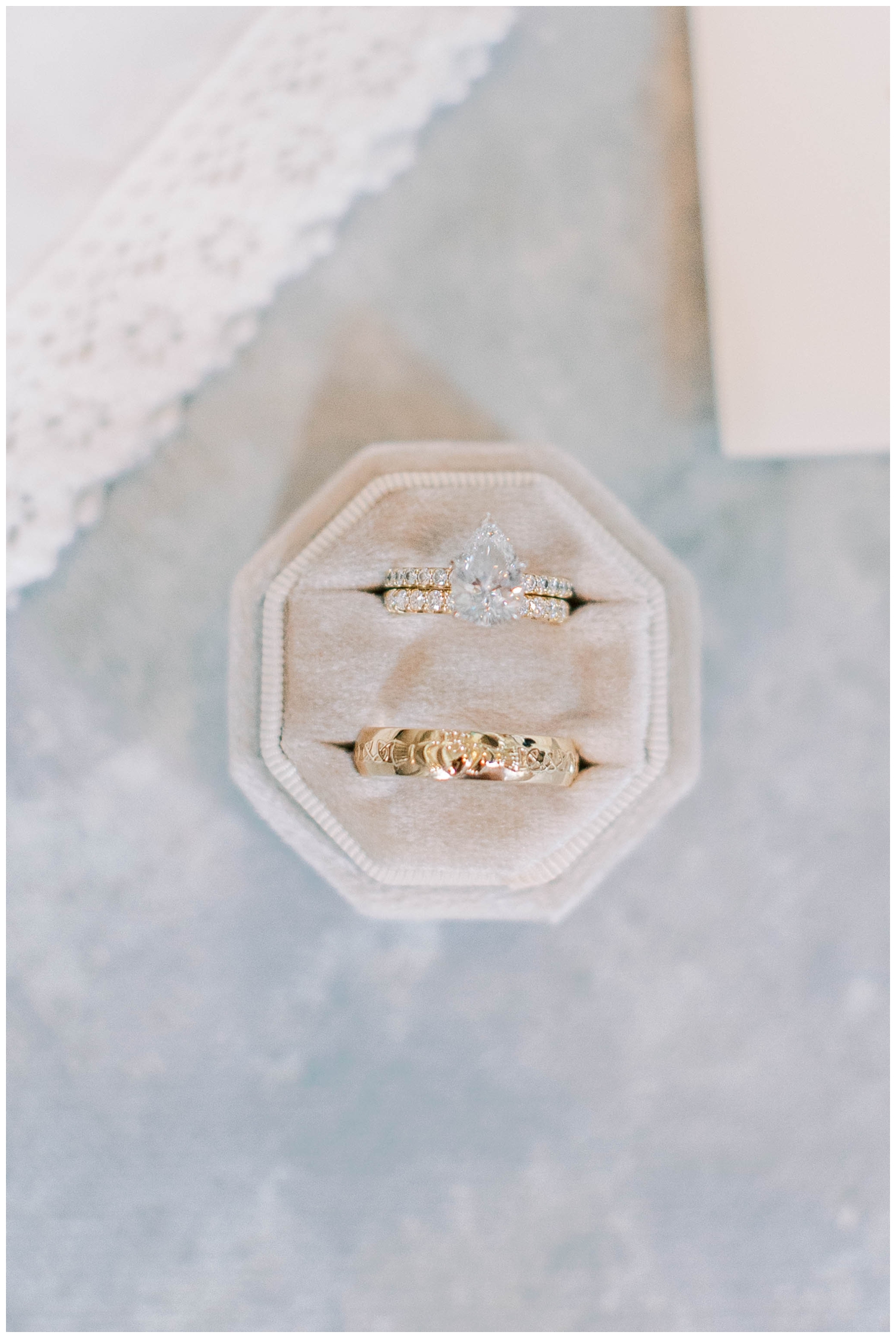 gold wedding ring in cream ring box