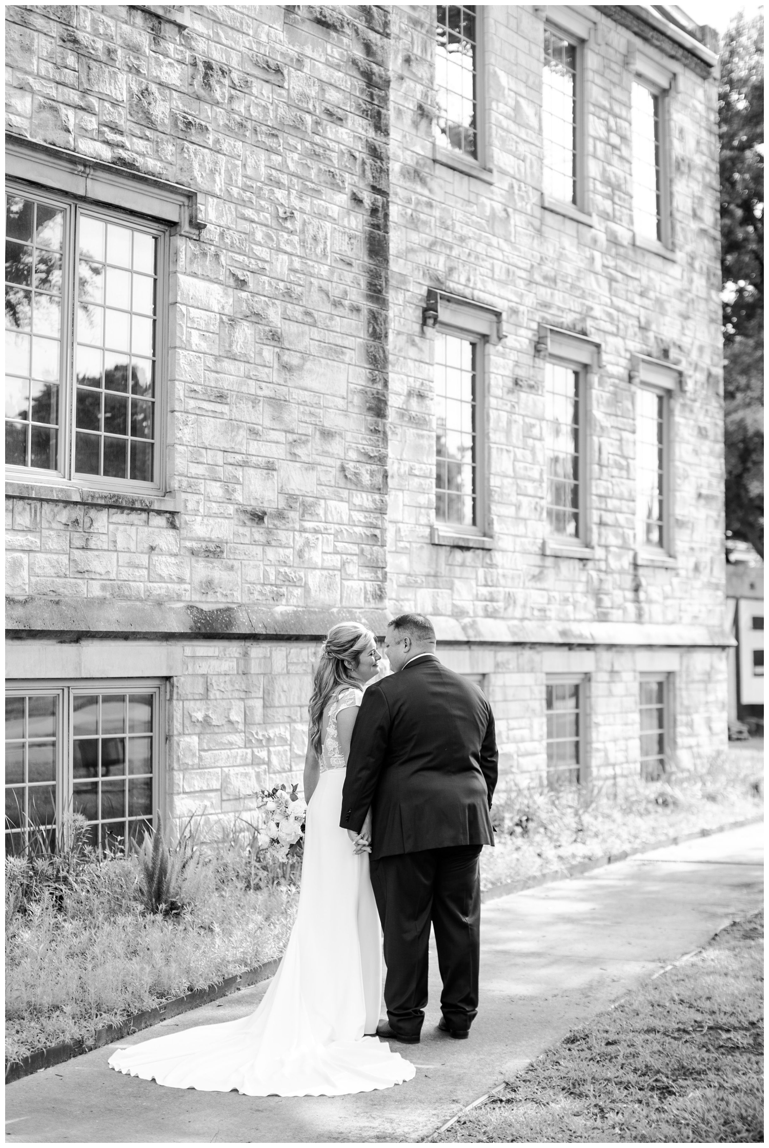 bride and groom hugging outside St. Marks United Methodist Church Houston