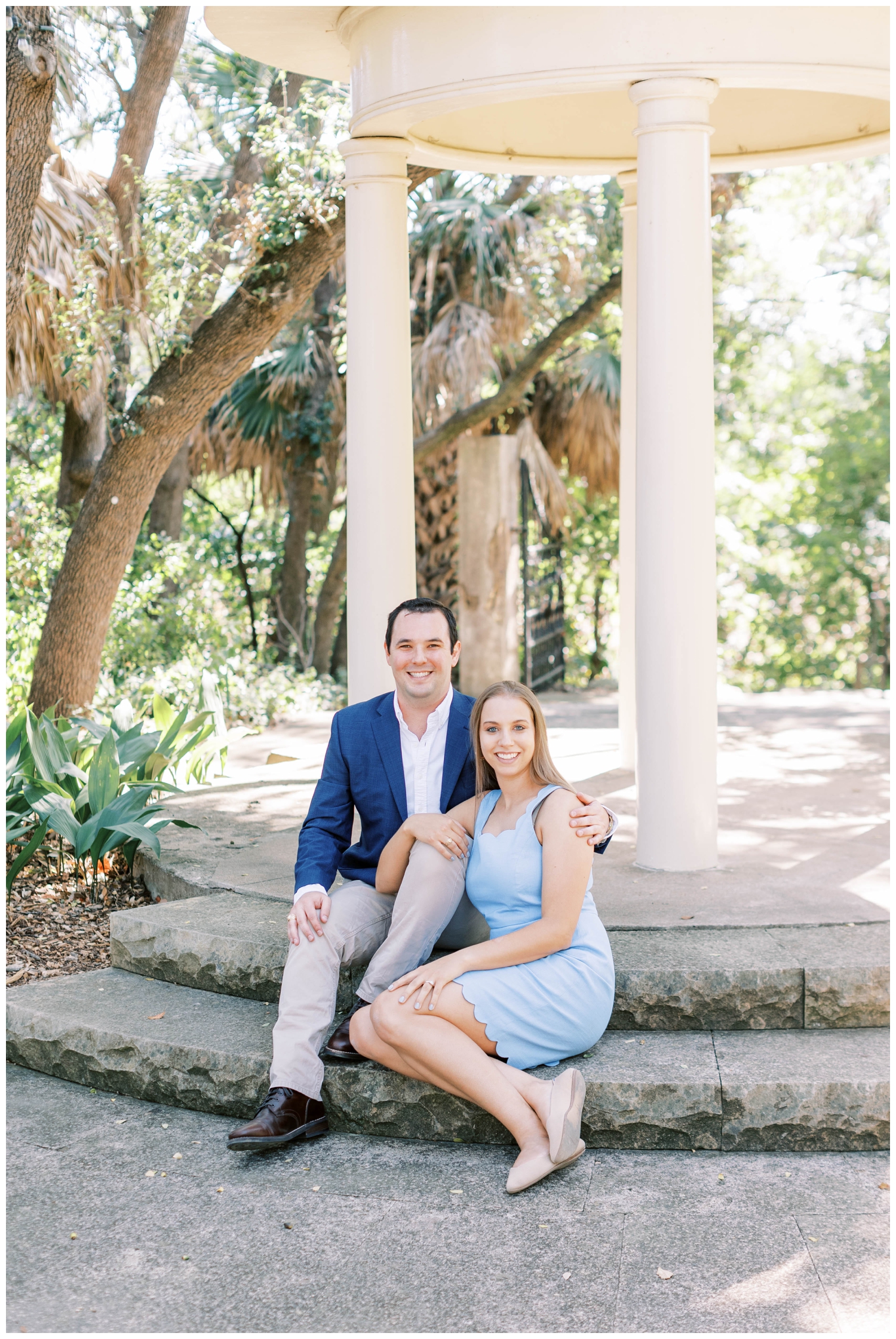 Laguna Gloria engagement session outdoors with couple sitting by columns