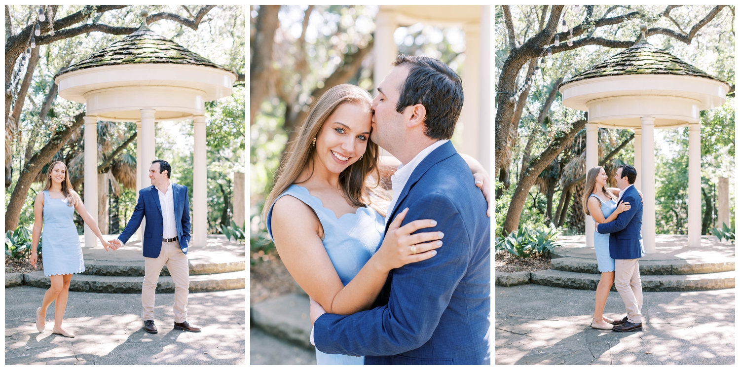 engaged couple in blue suit and dress standing outdoors by columns in Austin, Texas