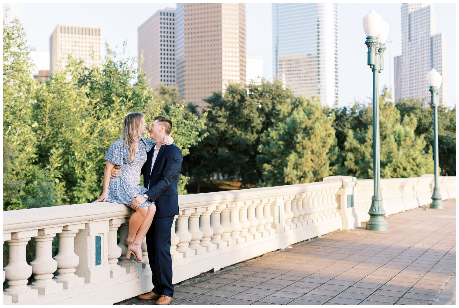 couple sitting on Sabine Street Bridge in Houston Texas