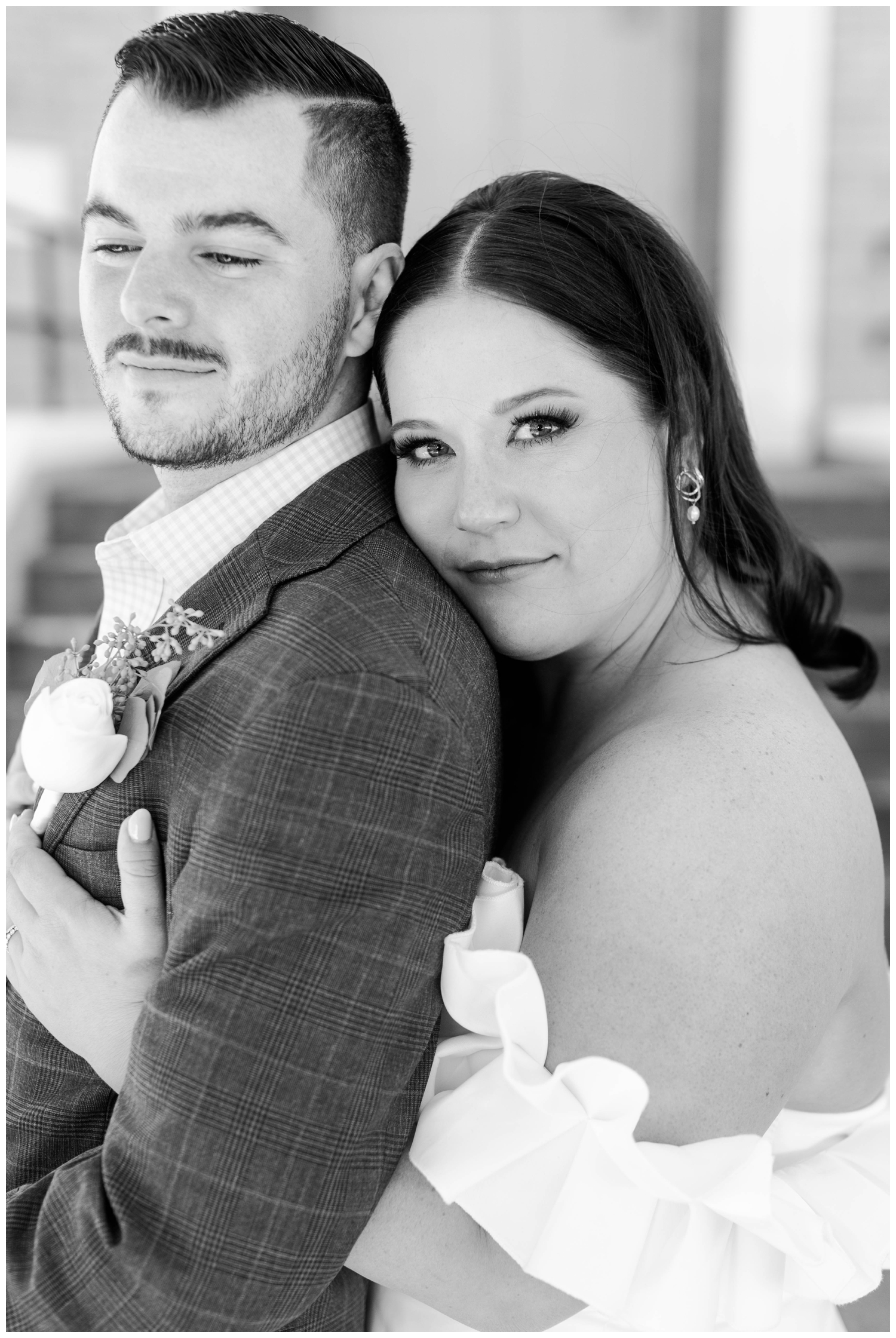 black and white image of bride hugging groom for Austin outdoor wedding