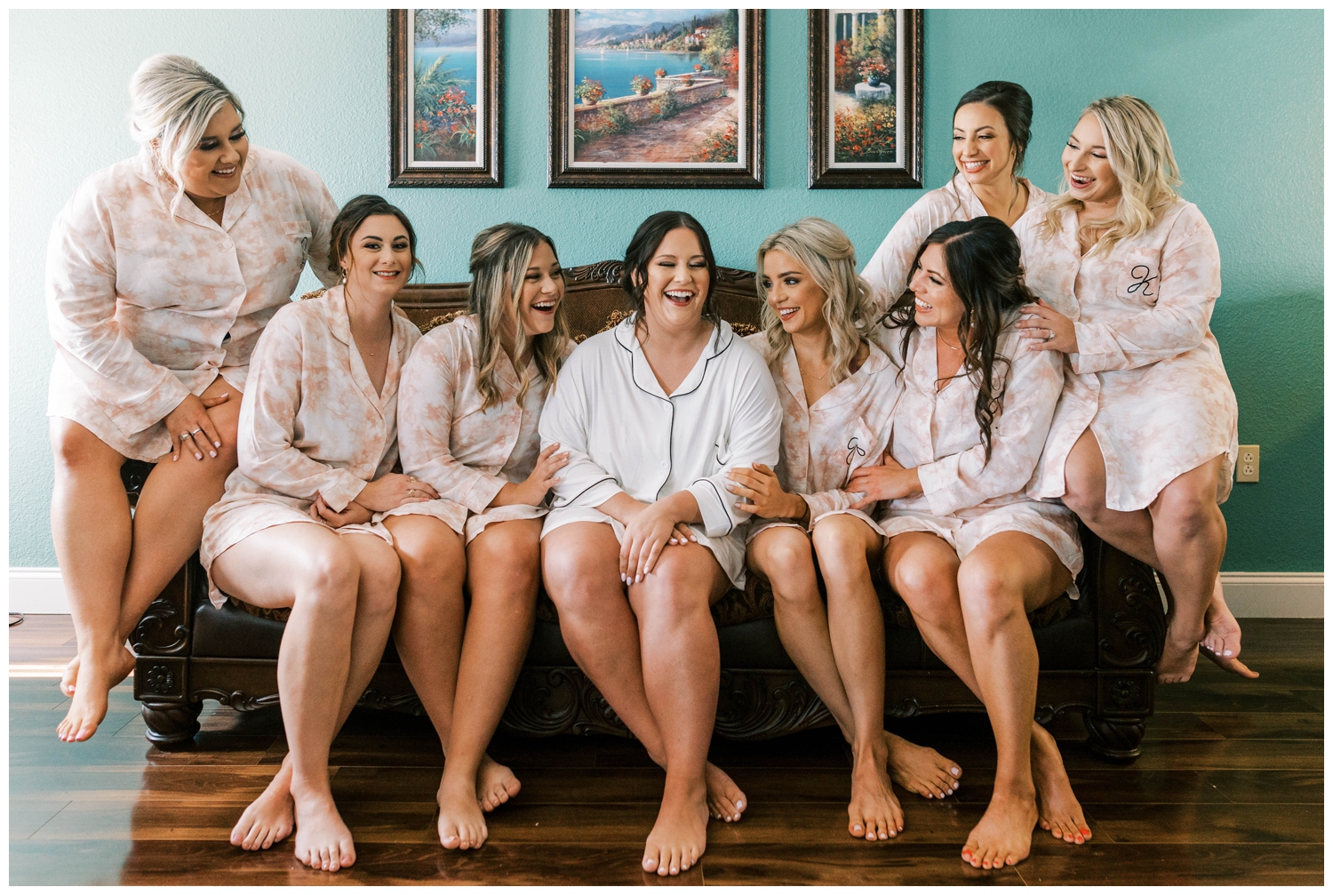 bride laughing with bridesmaids in matching pajamas Austin outdoor wedding