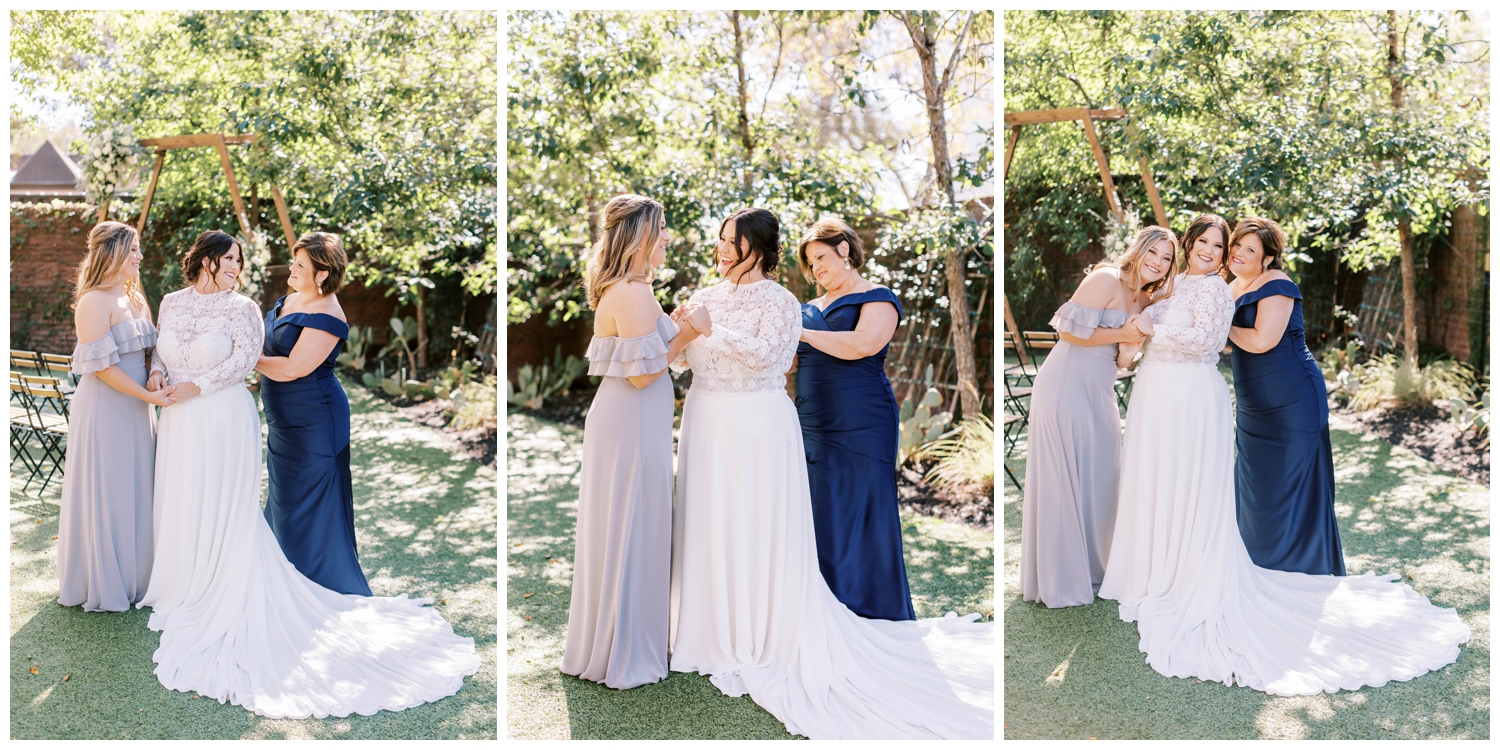 mother of bride fastening bride's gowns outside on lawn