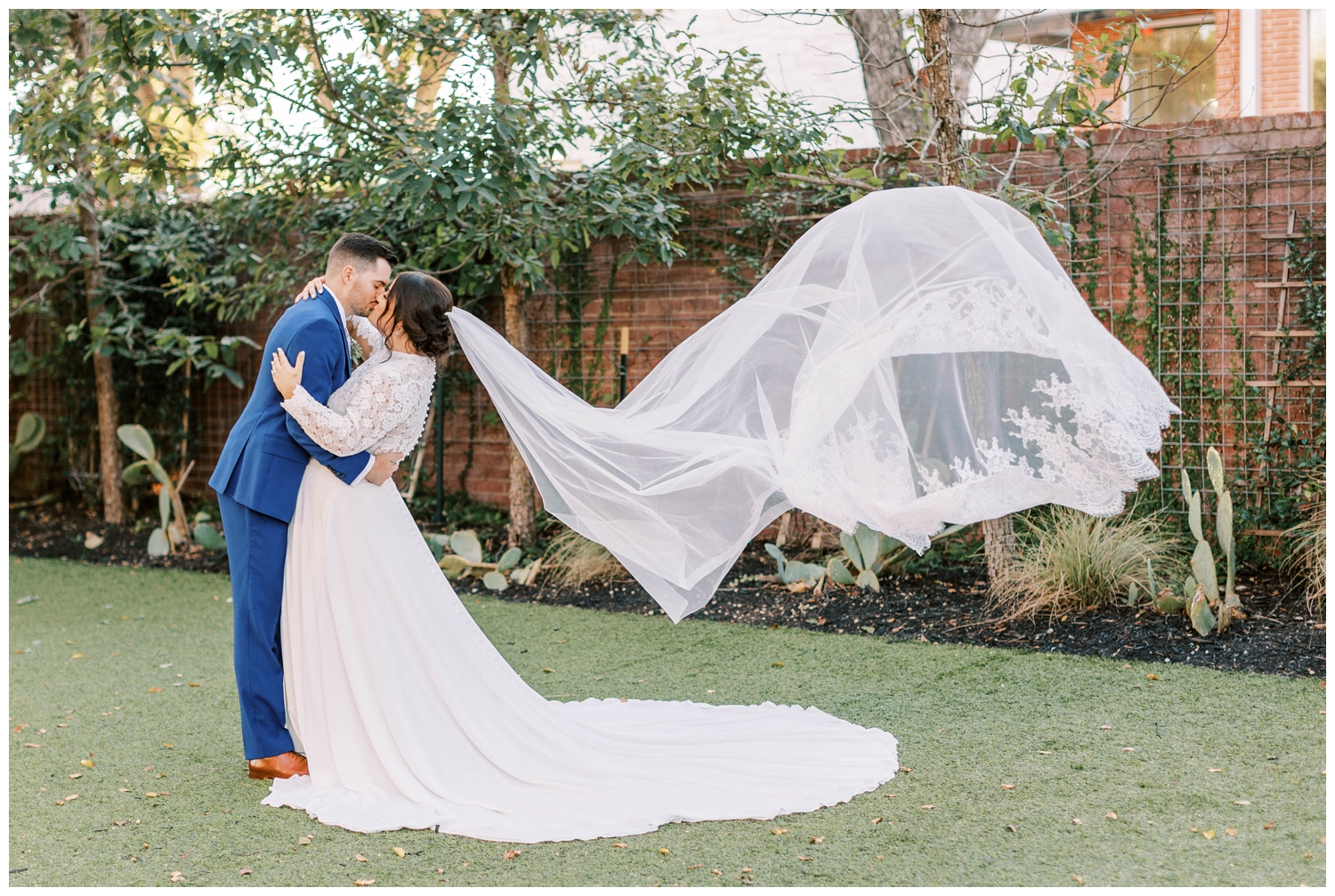 veil toss with bride and groom kissing for Aly Matei Photography