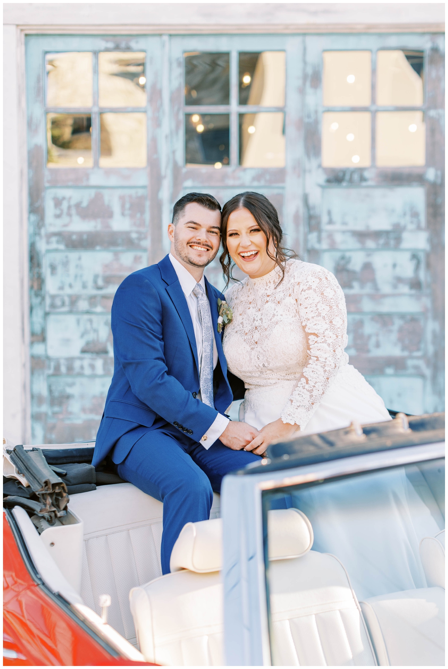 bride and groom sitting inside convertible car after Austin wedding ceremony