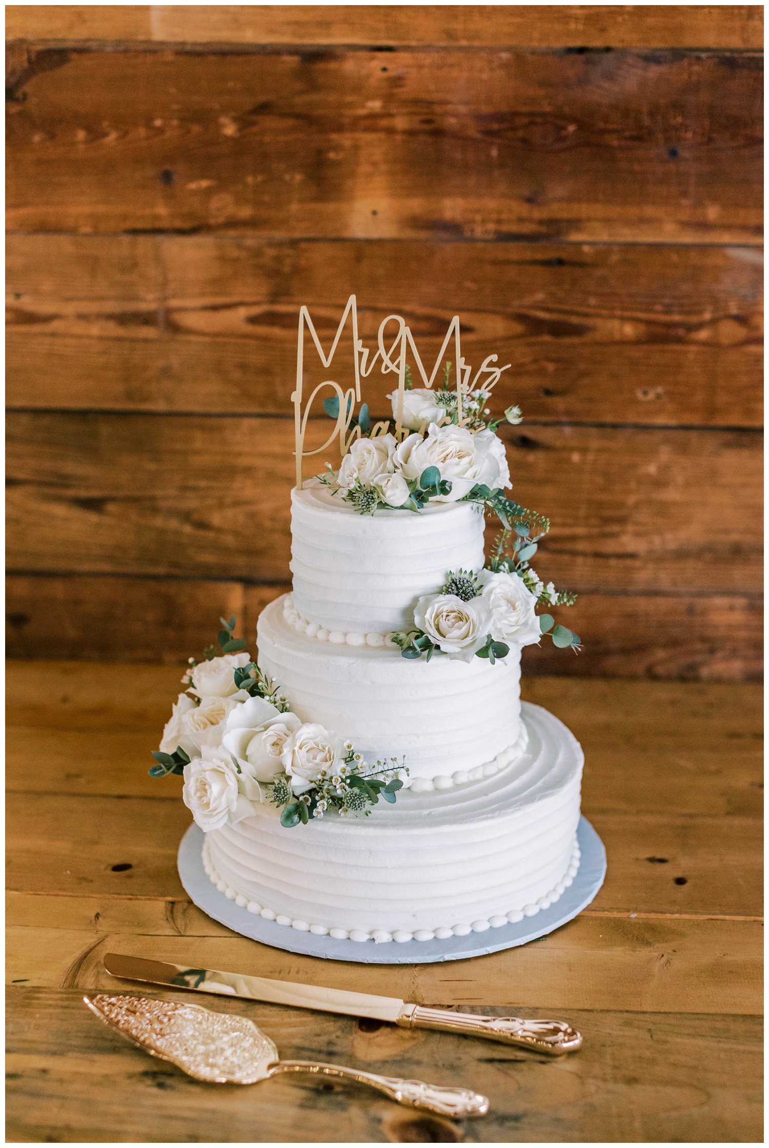 three tier white cake with florals