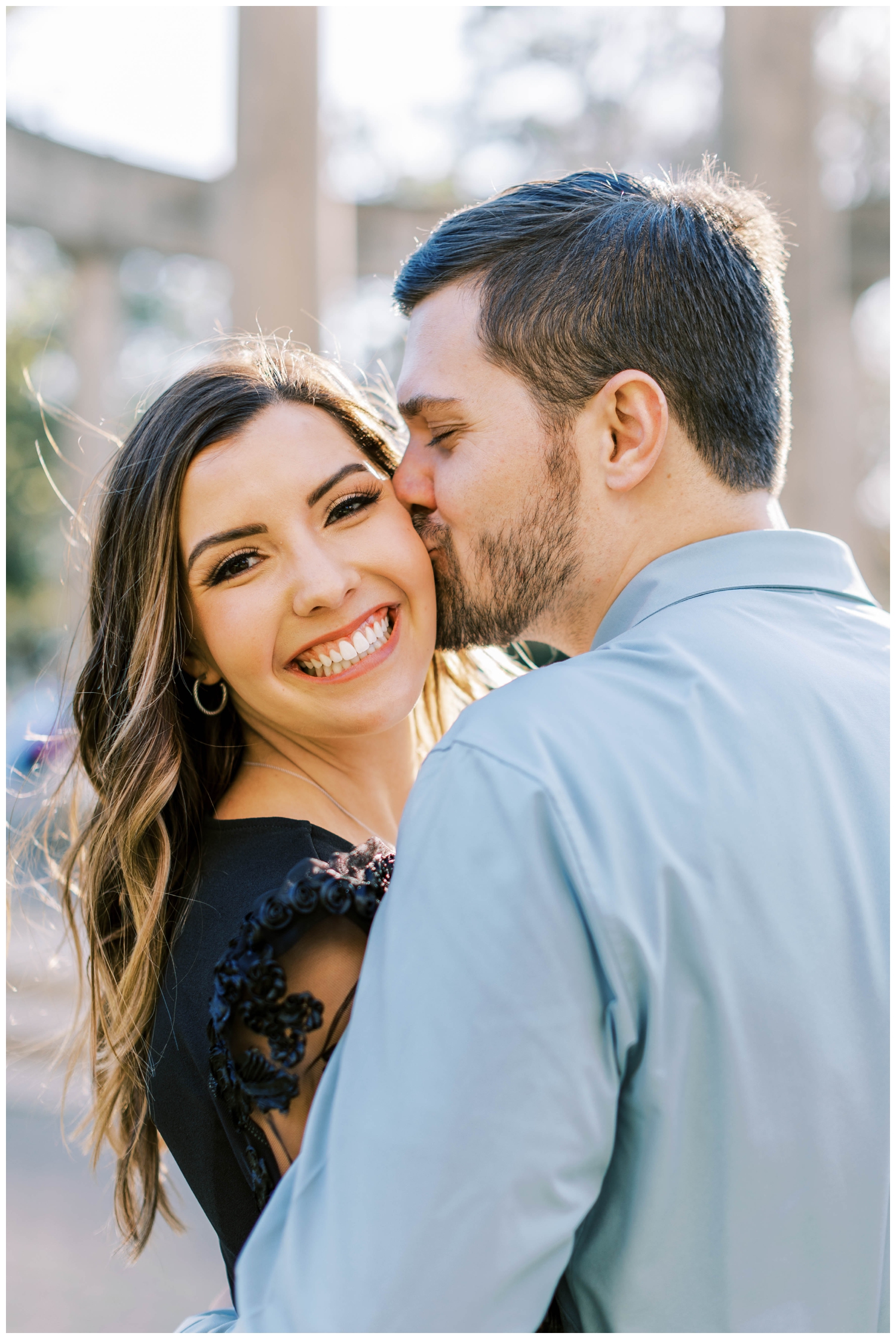 Galveston Wedding Photographer portrait session engaged couple kissing and smiling