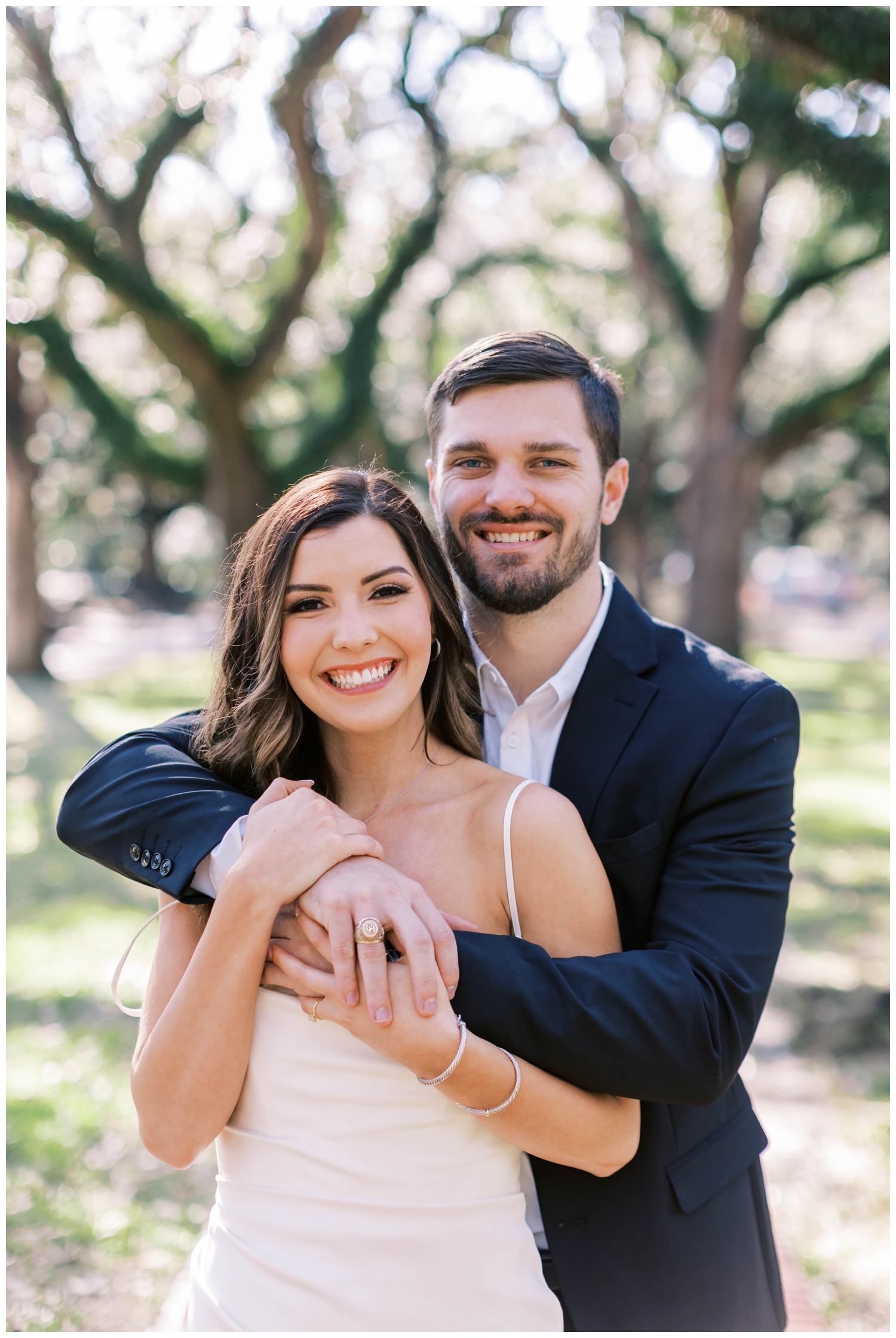 engaged couple smiling at camera for Galveston Wedding Photographer