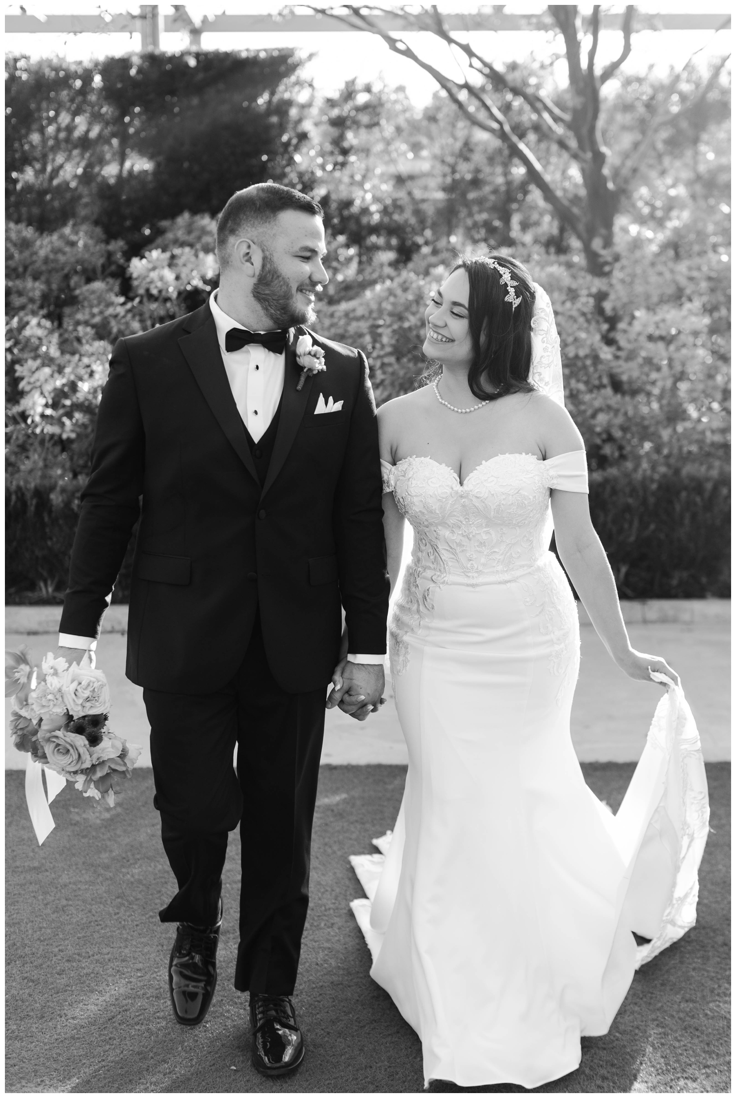 black and white portrait McGovern Centennial Gardens Wedding bride groom wallking and holding hands