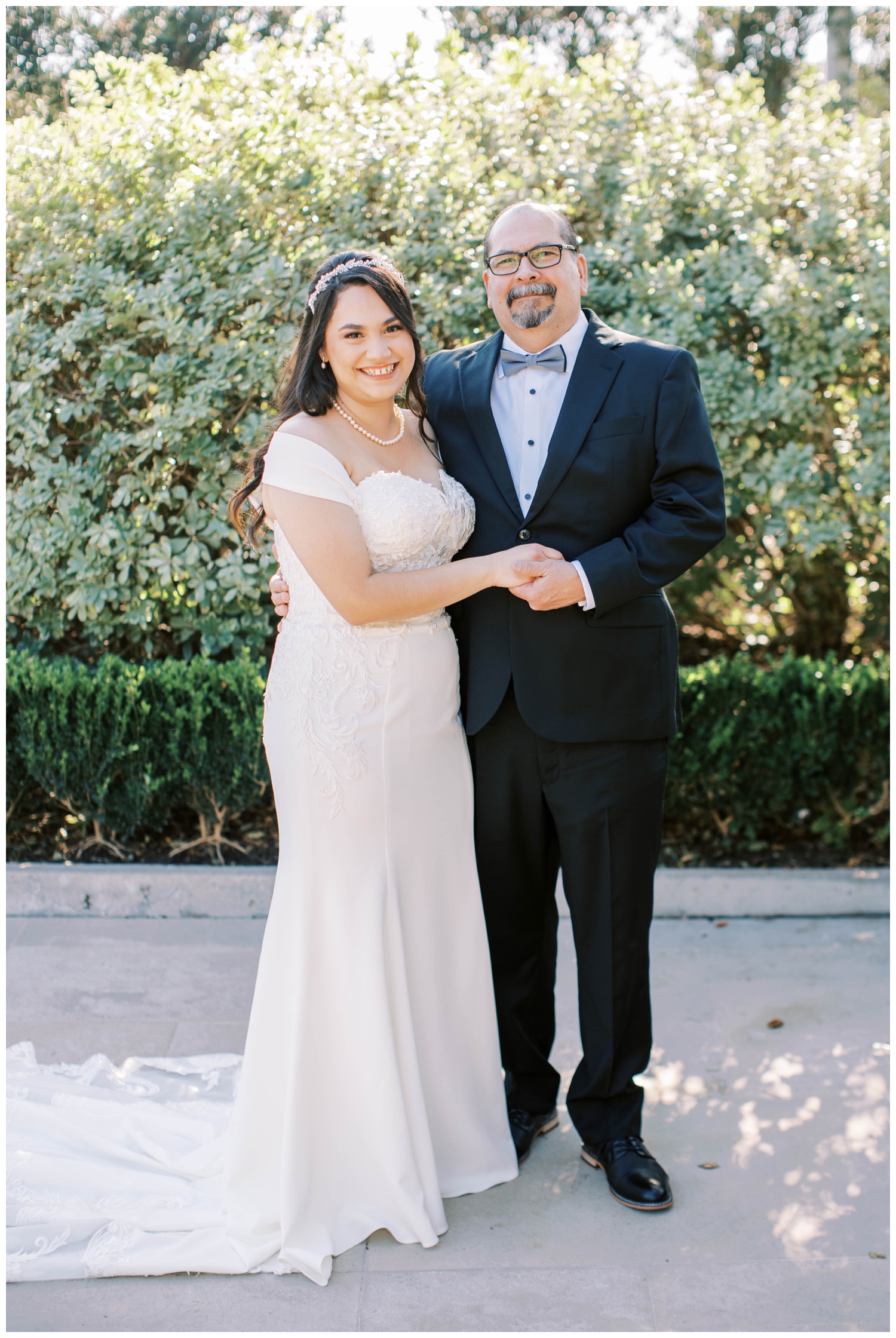 bride and father holding hands outdoors at McGovern Centennial Gardens Wedding