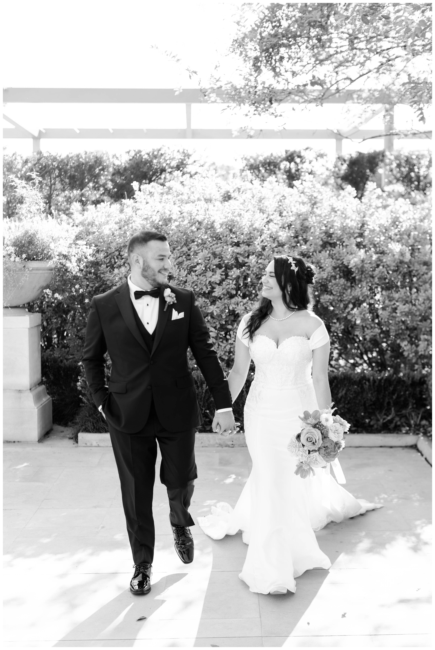 McGovern Centennial Gardens Wedding black and white image bride groom holding hands walking