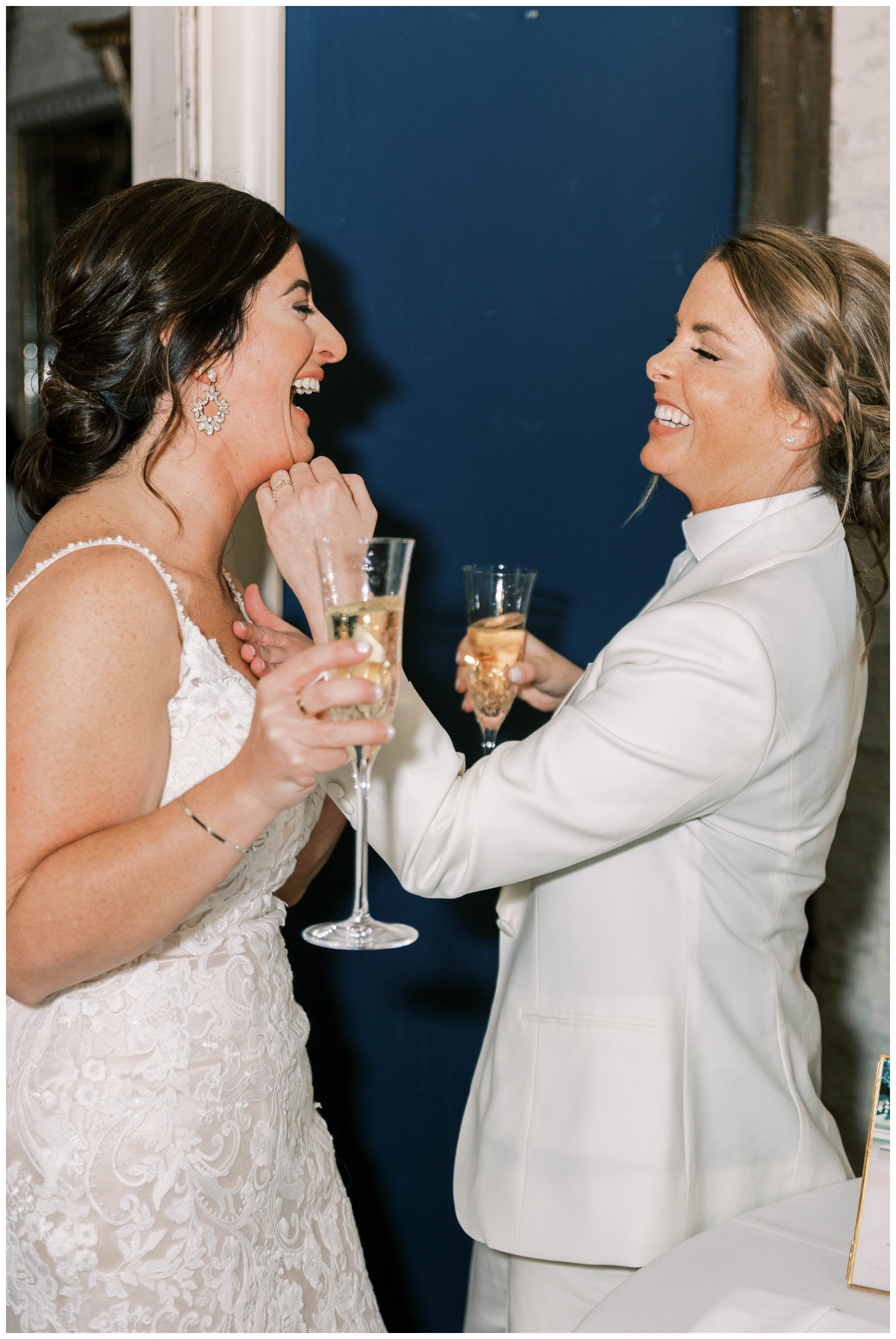bride and bride toasting at reception