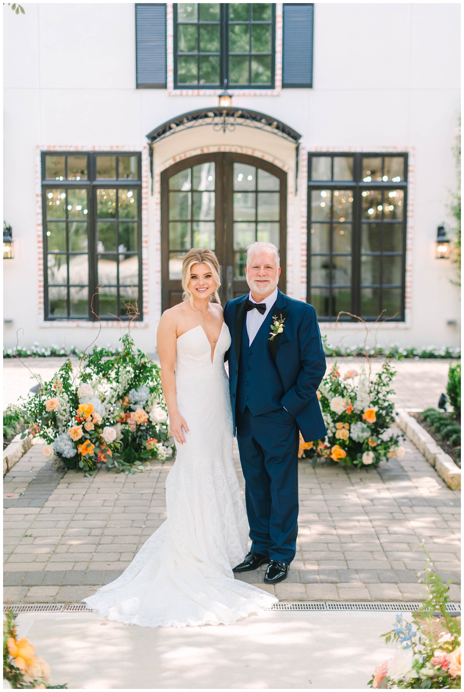 father daughter smiling outside The Peach Orchard wedding venue after first look