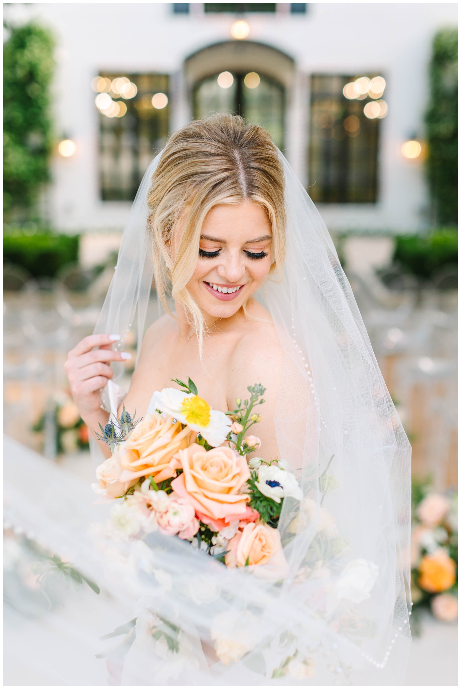 bridal portrait with veil swoop and peach bouquet