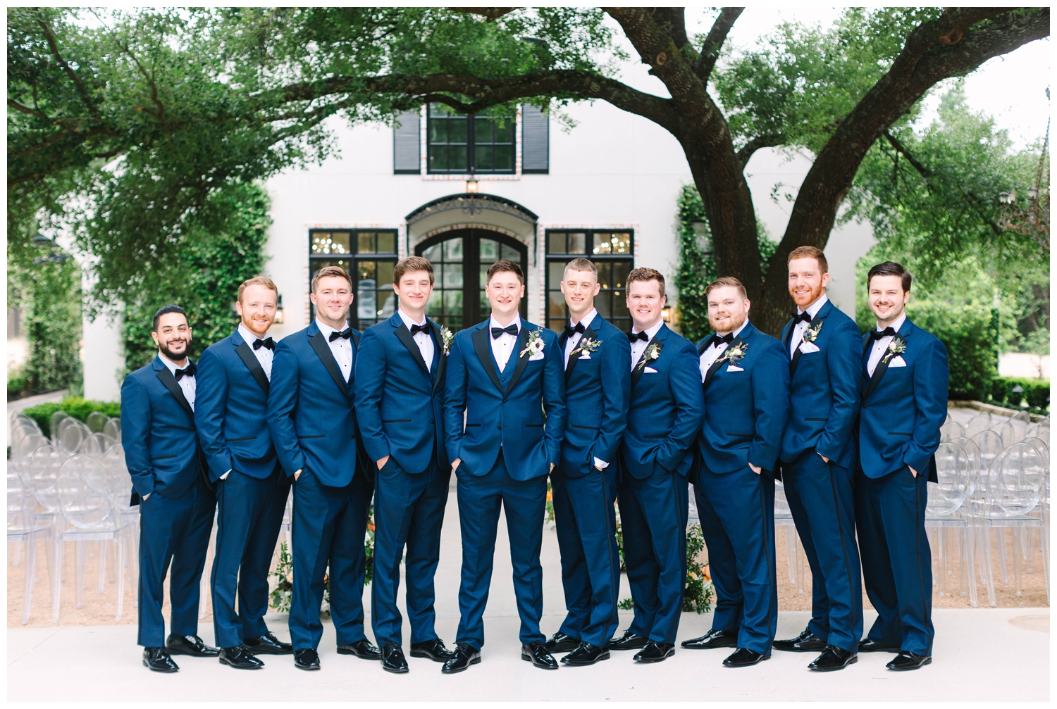 groom and groomsmen portrait at The Peach Orchard Venue in all blue tuxes