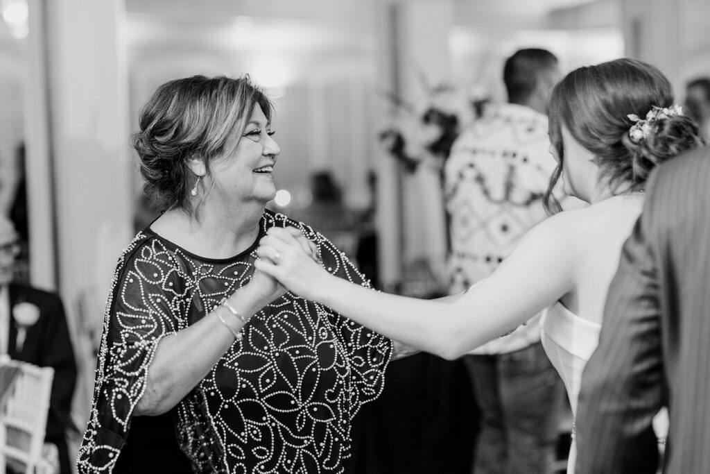 Bride and her mother dancing