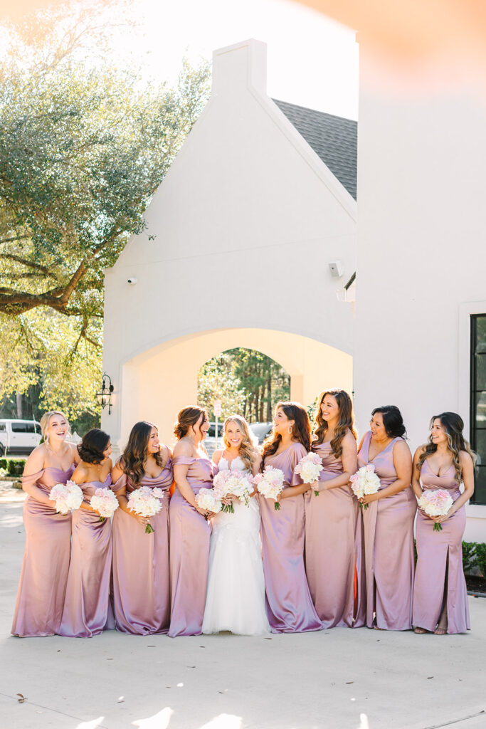 Bride and bridesmaids photos outside of The Peach Orchard wedding venue