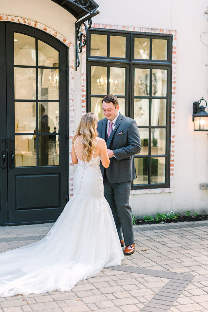 Bride and grooms first looks outside of The Peach Orchard - The Woodlands Wedding Venue