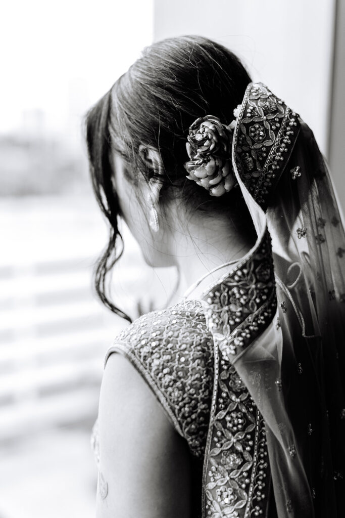 South Asian bride getting ready before wedding at Omni Hotel in Houston
