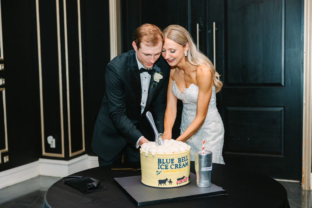 Bride and groom cutting wedding cakes