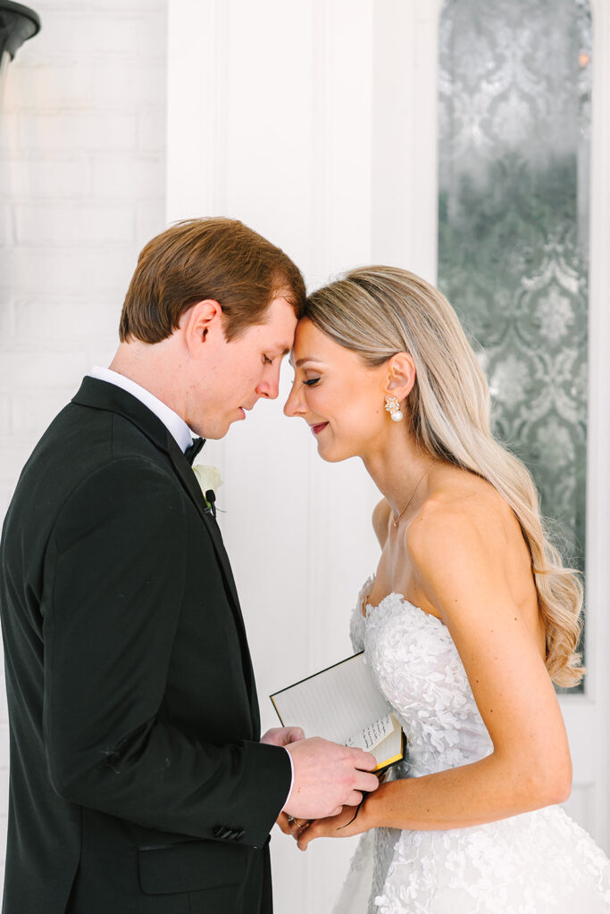 Bride and grooms first touch and first looks outside of Sandlewood Manor Houston wedding venue