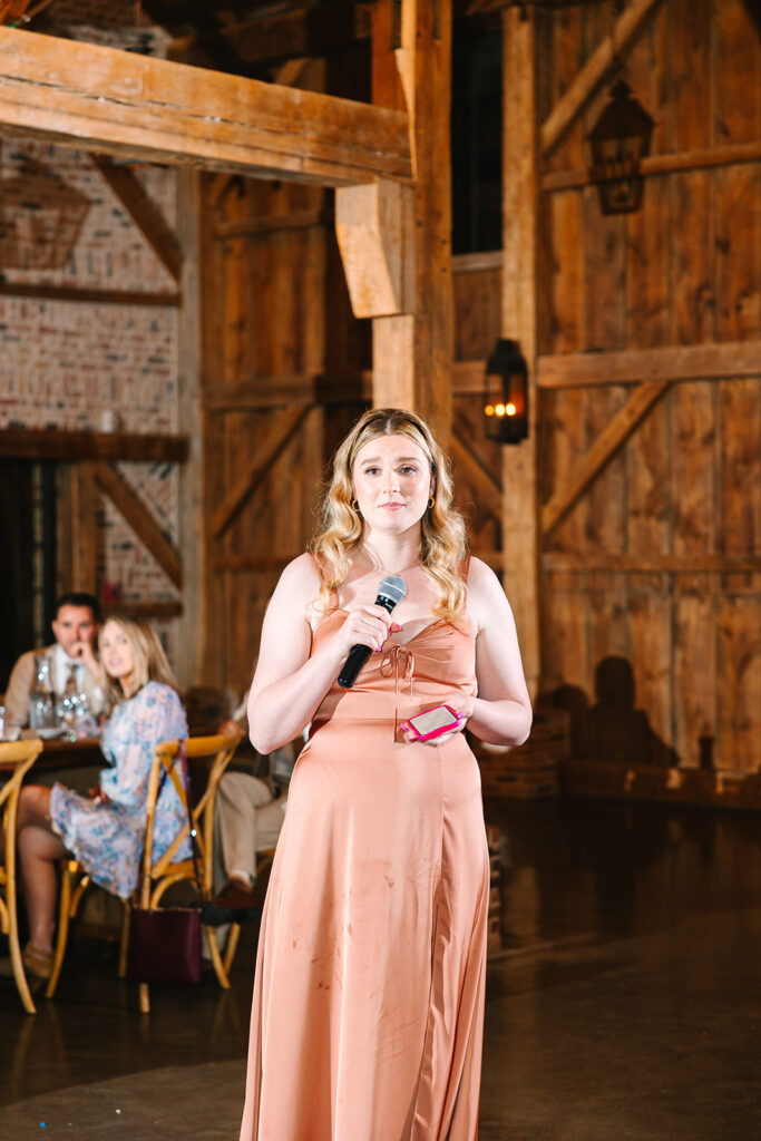 Maid of honor giving speech at wedding