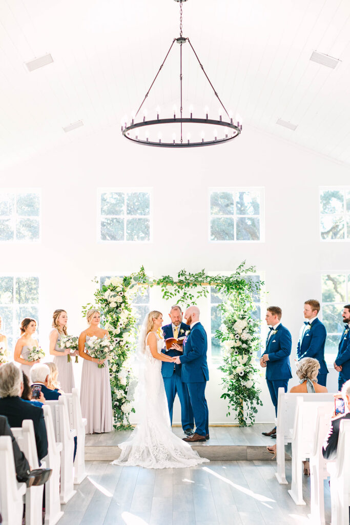 An indoor wedding ceremony at Laura May Chapel