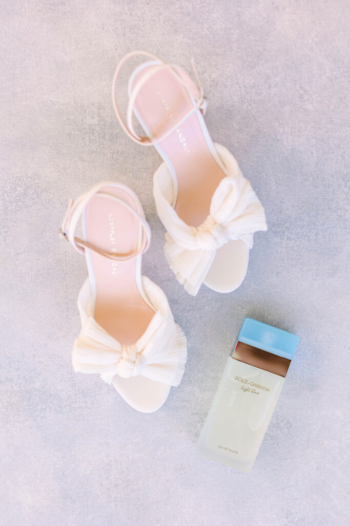 Wedding shoes and perfume bottle