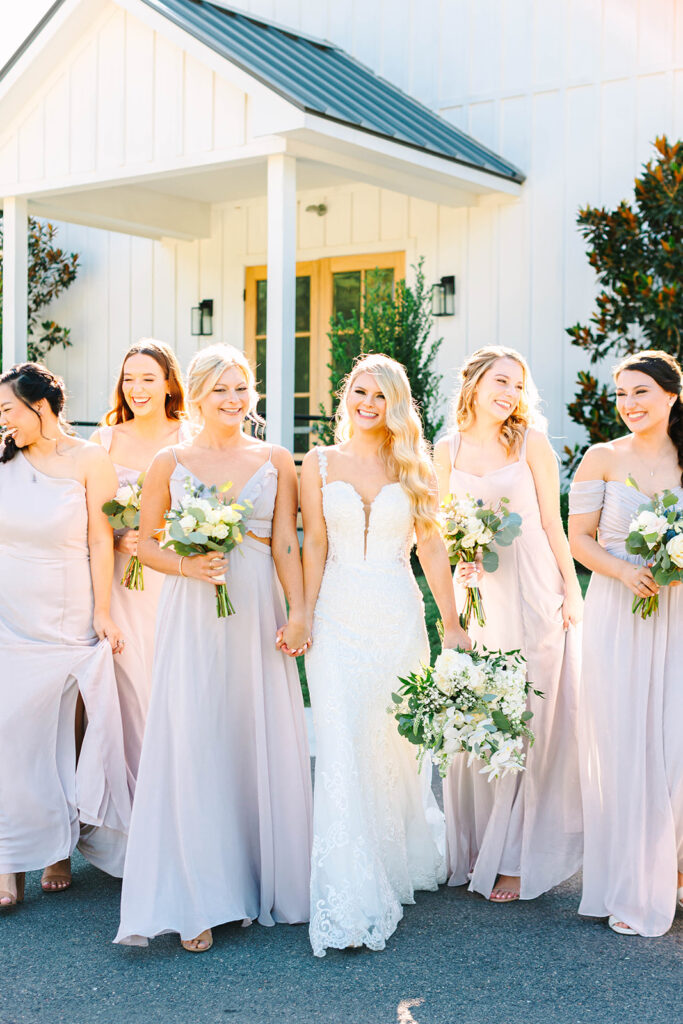 Bride and bridesmaids photos from a timeless wedding at Addison Woods Wedding & Event Venue