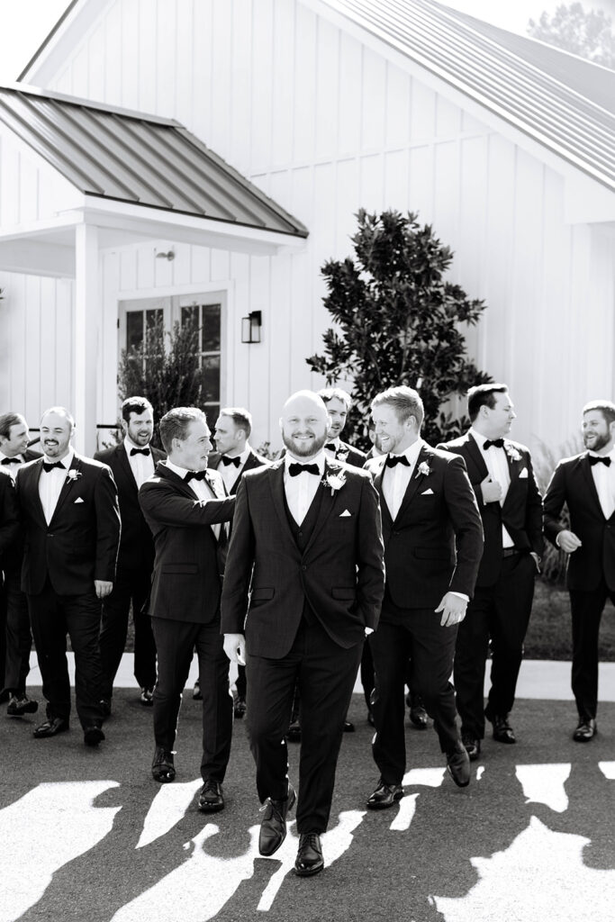 Groom and groomsmen photos from a timeless wedding at Addison Woods Wedding & Events Venue