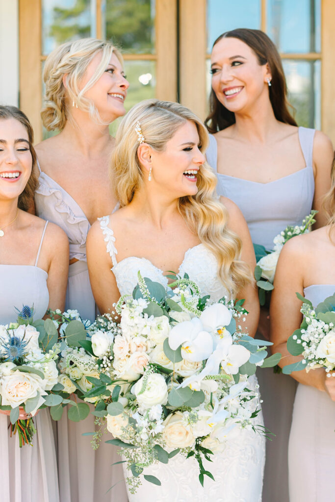 Bride and bridesmaids photos from a timeless wedding at Addison Woods Wedding & Event Venue