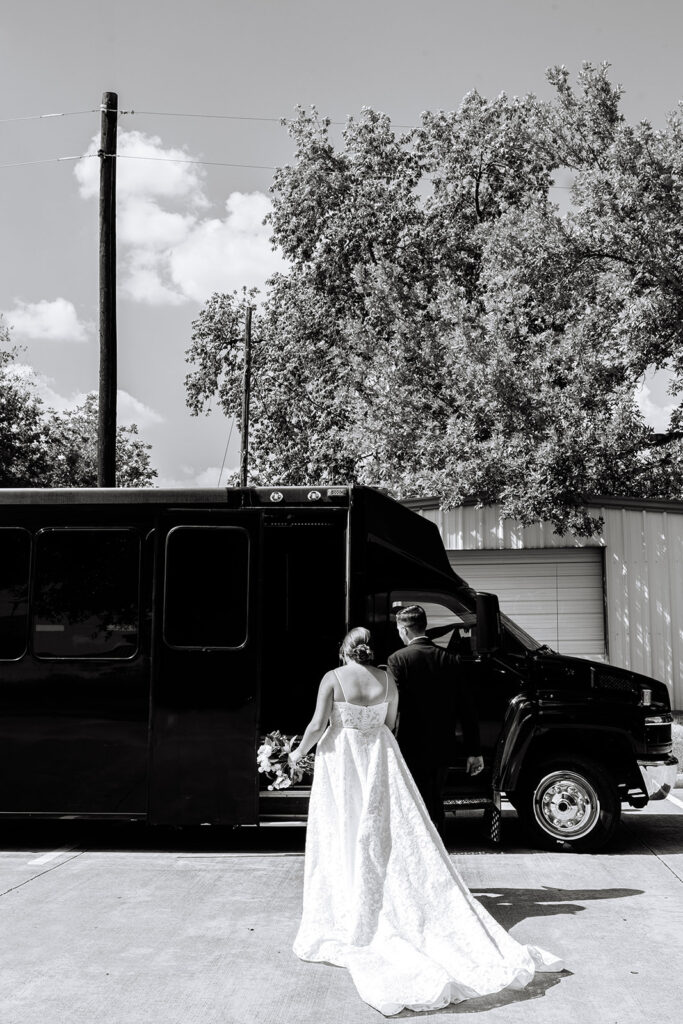 Bride and groom getting on party bus